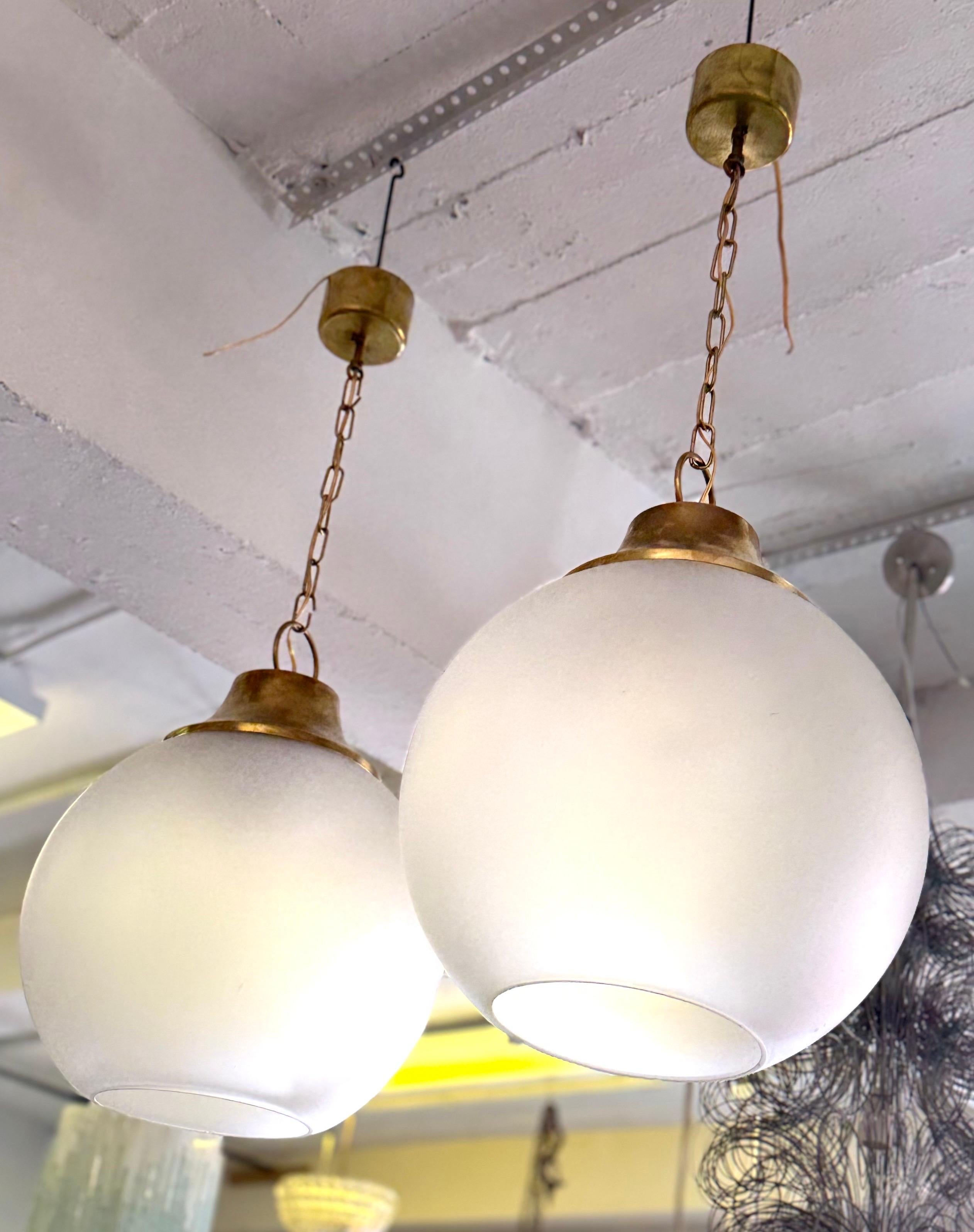 Mid-Century Modern Pair of Italian Midcentury Brass & Satin Glass Ball Pendants by Caccia Dominioni For Sale