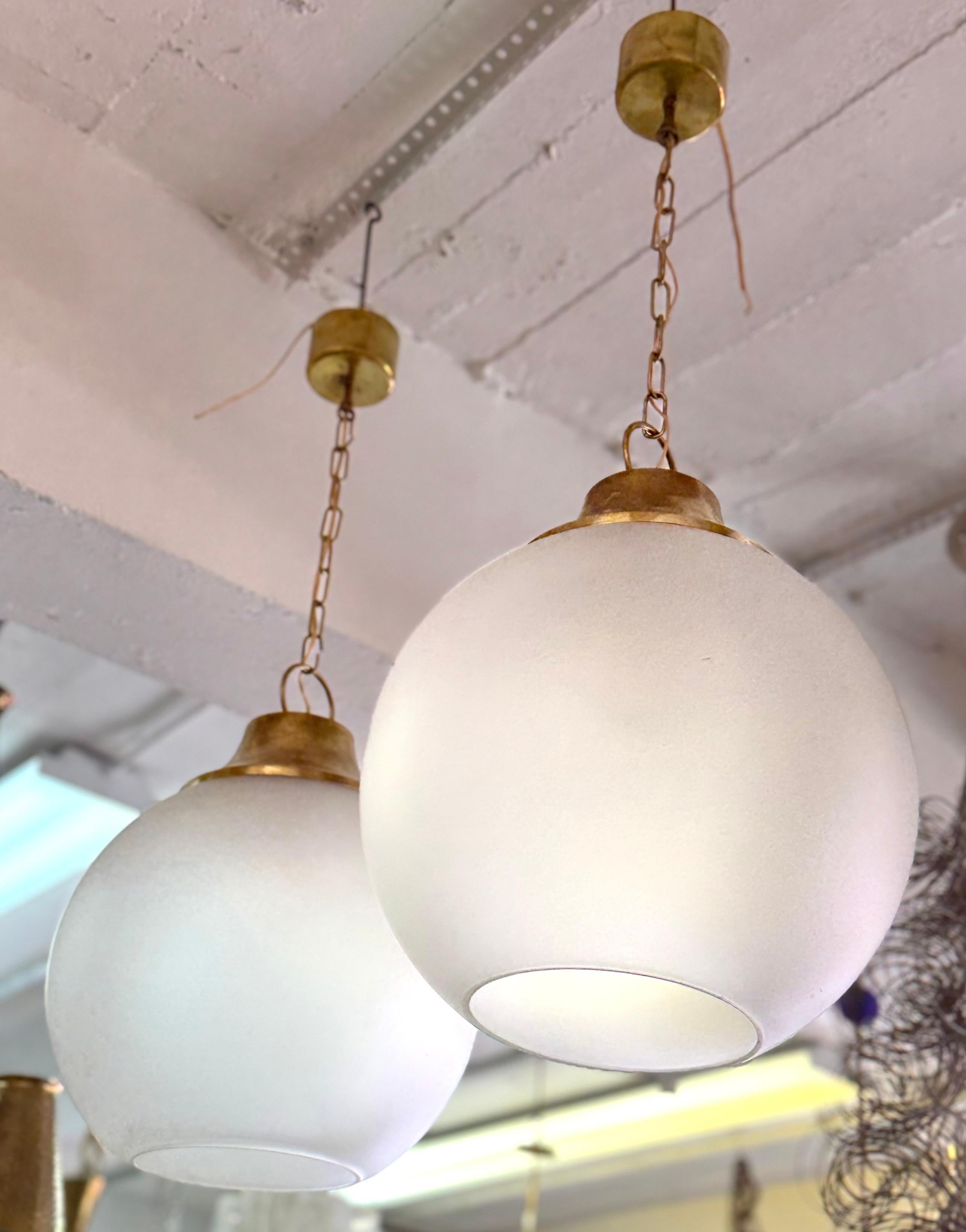 Pair of Italian Midcentury Brass & Satin Glass Ball Pendants by Caccia Dominioni In Good Condition For Sale In New York, NY