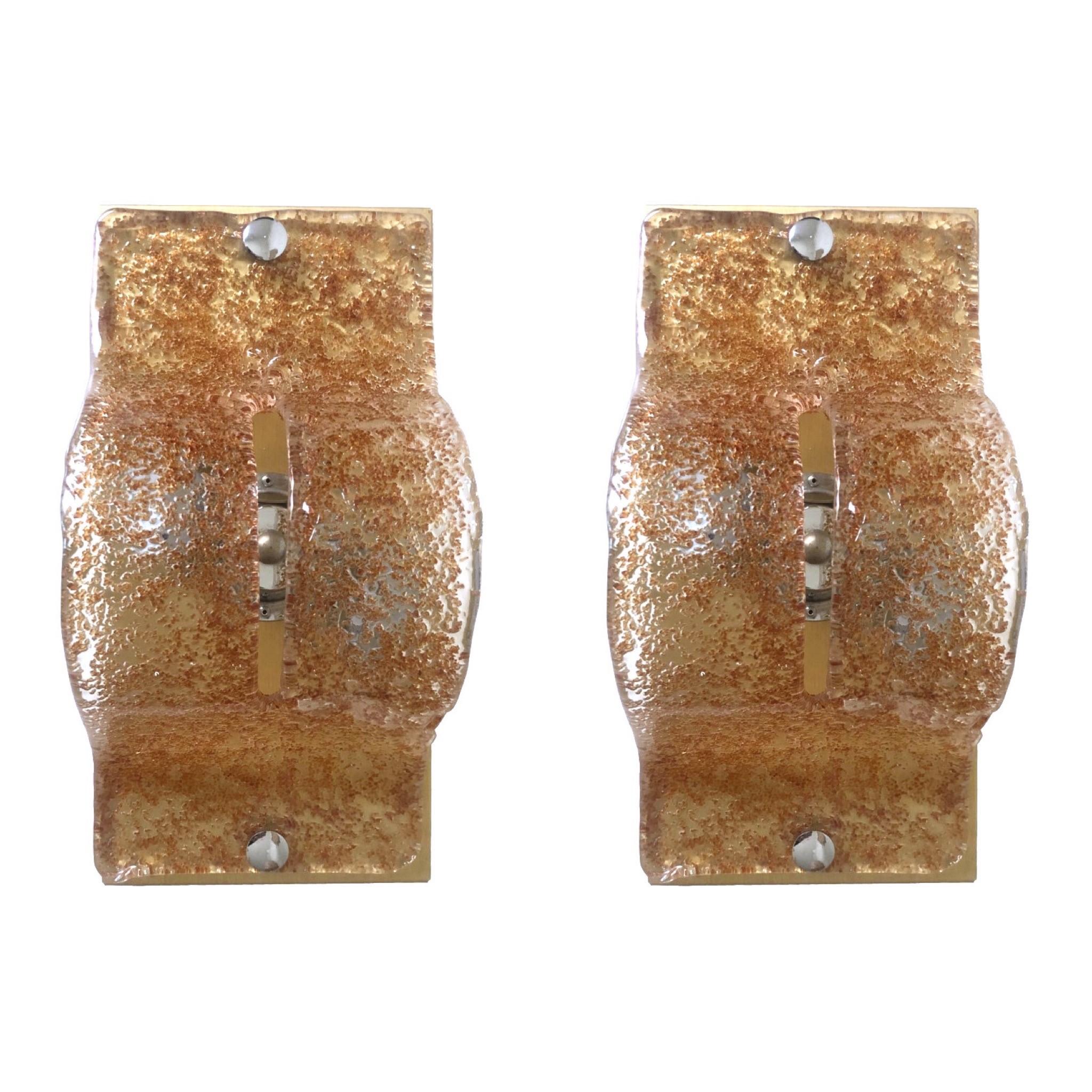 Unique and stunning Italian Murano caramel color glass Wall Sconces. These pieces were made during the 1970s in Murano, Italy for the Venice Company “Mazzega”.
Mazzega lie in the noble Venetian glassworking tradition; the firm was founded Angelo