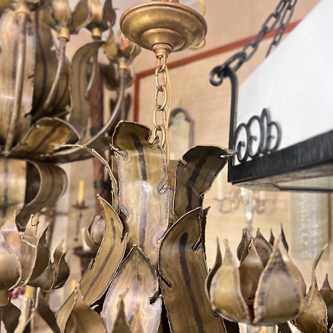 Pair of circa 1960's Italian patinated bronze chandeliers with foliage design.

Measurements:
Height: 34”
Diameter: 27”

