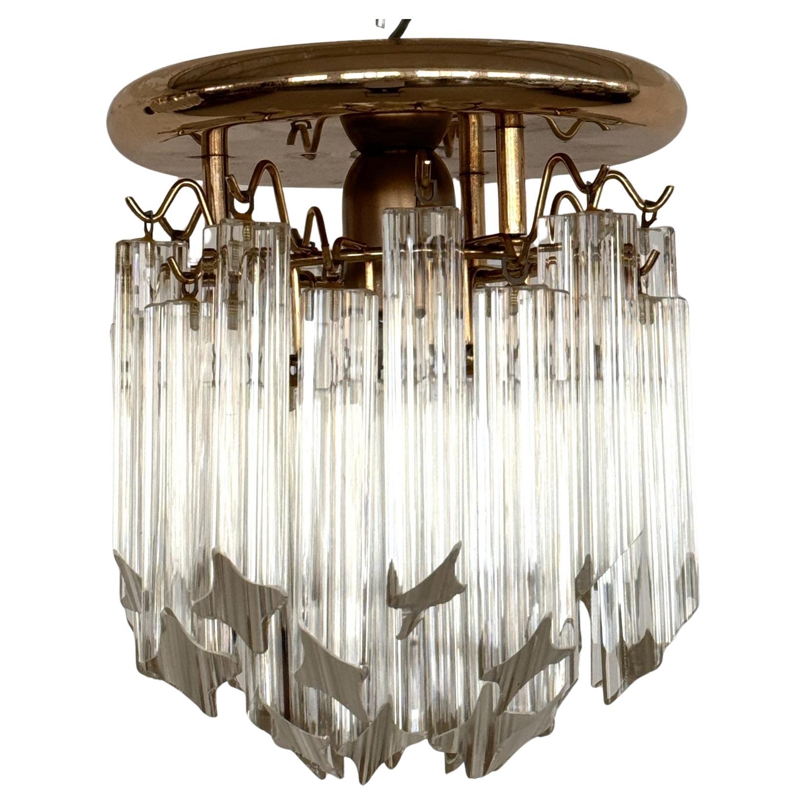 Pair of Italian Midcentury Murano Glass Trilobi Flush Mount Chandelier, 1970s

Nice and very shiny pair of flush mount chandeliers with original Murano made trilobi glasses mounted on a golden colored metal lamp holder.
Each pendant light mounts 27