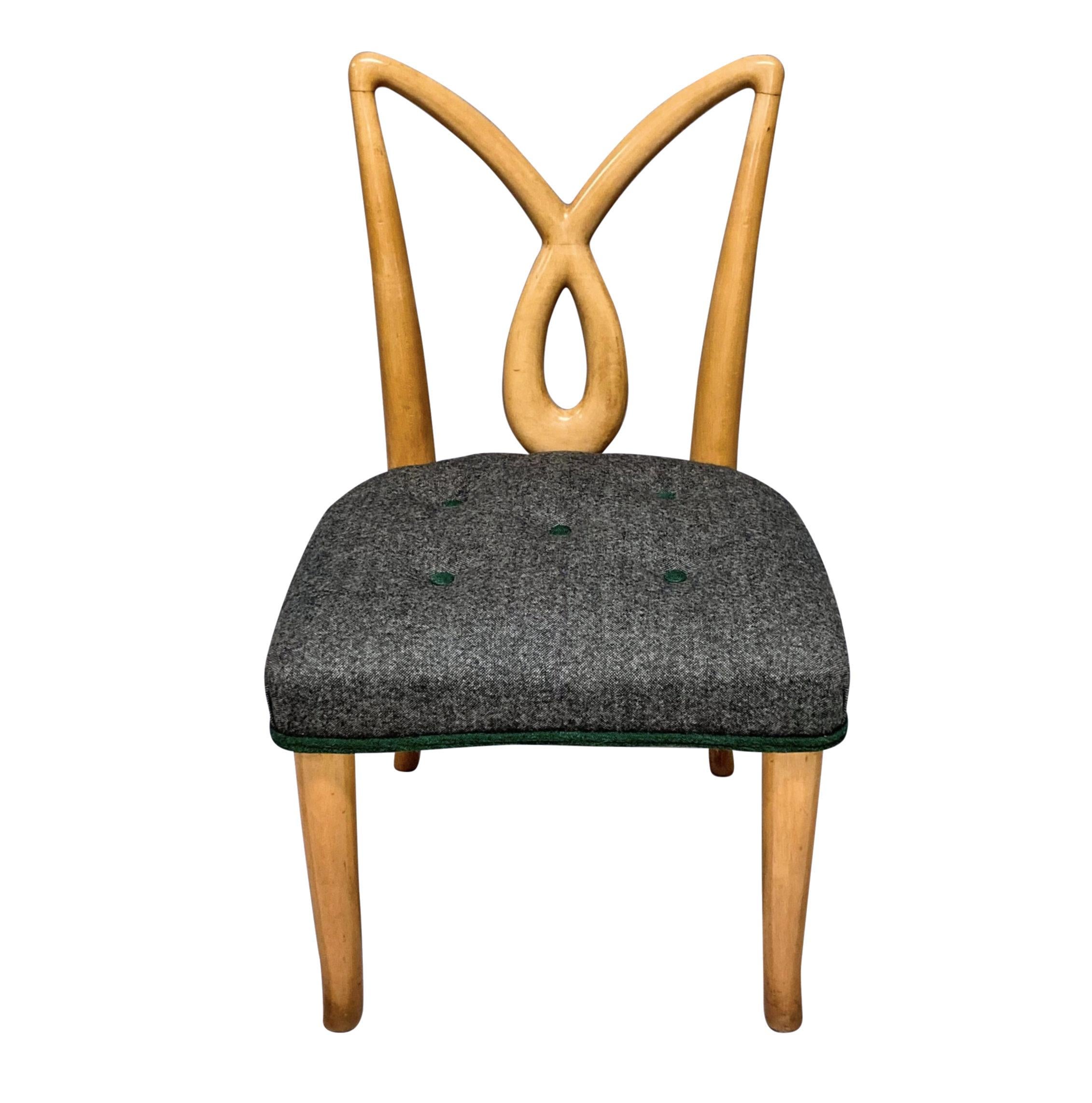 A pair of Italian Mid-Century hall chairs with sculptural backs, in lemon wood. The seats newly upholstered in grey wool with emerald green detailing.