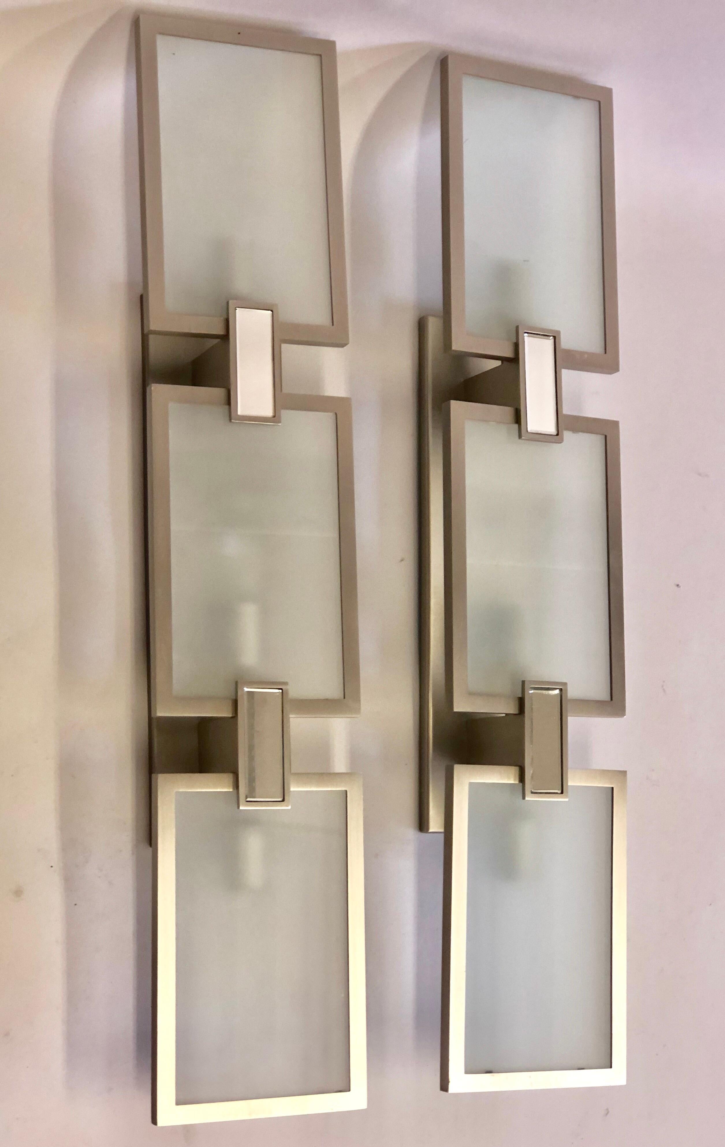 Pair of Italian style Mid-Century Modern style nickel, mirror and frosted glass sconces.
Can be wall or ceiling mounted as a flush mount. 3 lights, candelabra sockets, 40 watt max. each light.