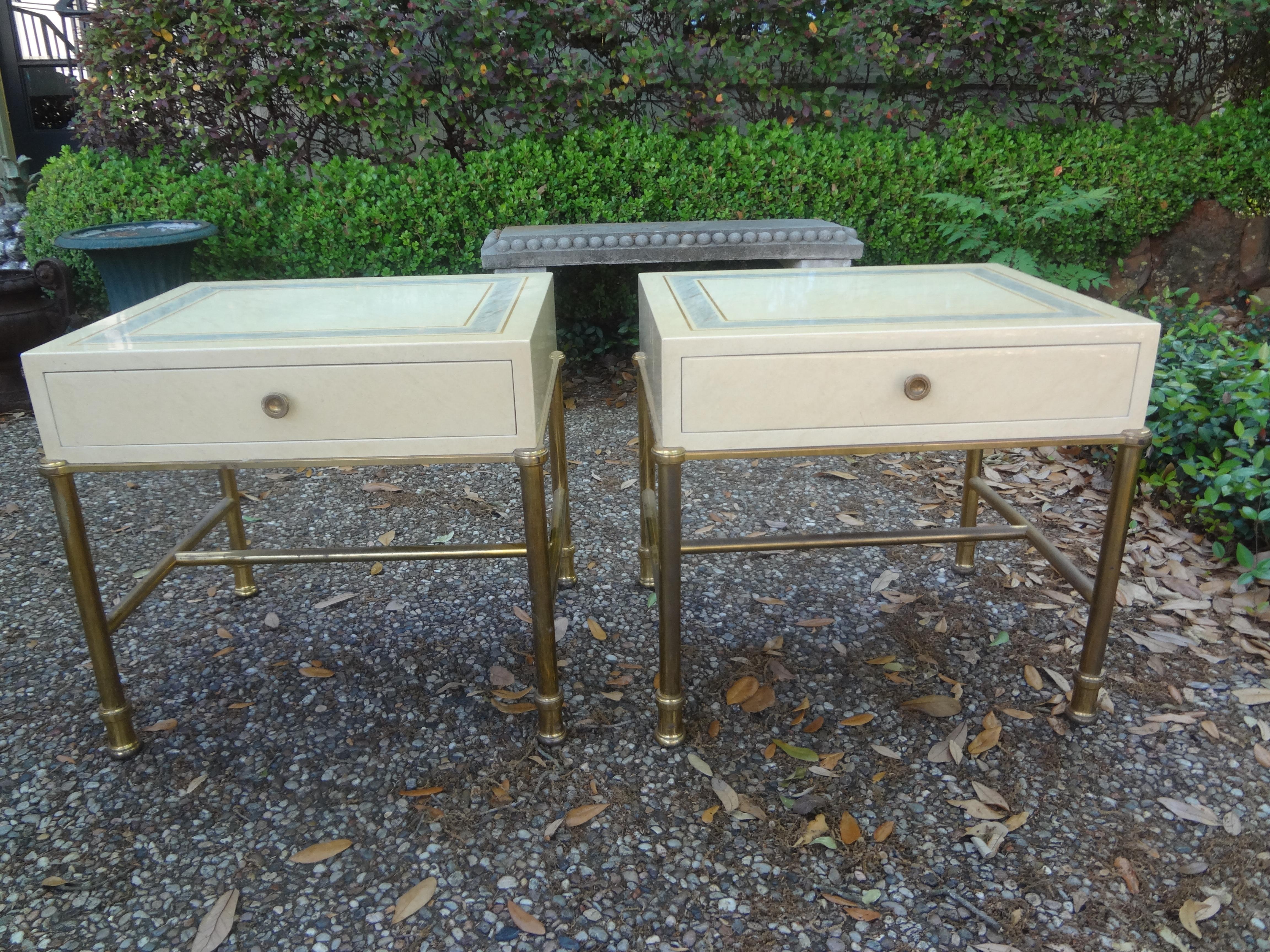 Pair of Italian modern brass and lacquered tables attributed To Willy Rizzo.
This stunning pair of Italian Willy Rizzo style Hollywood Regency side tables, nightstands or bedside tables have brass bases, lacquered tops and drawers.
These well made