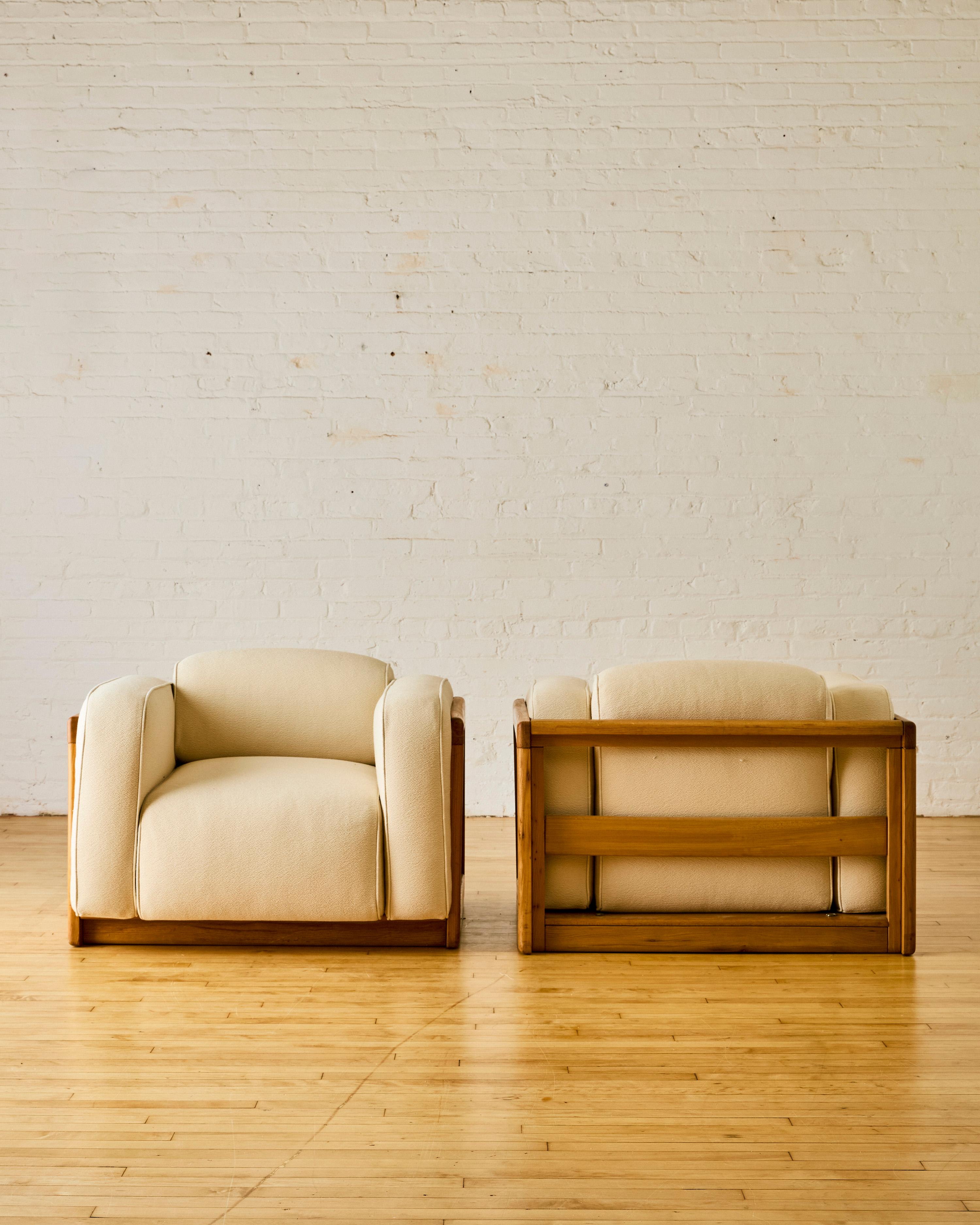 Pair of Italian modern cube chairs reupholstered in a Pierre Frey cream boucle with tonal piping originally from the 1970's. 