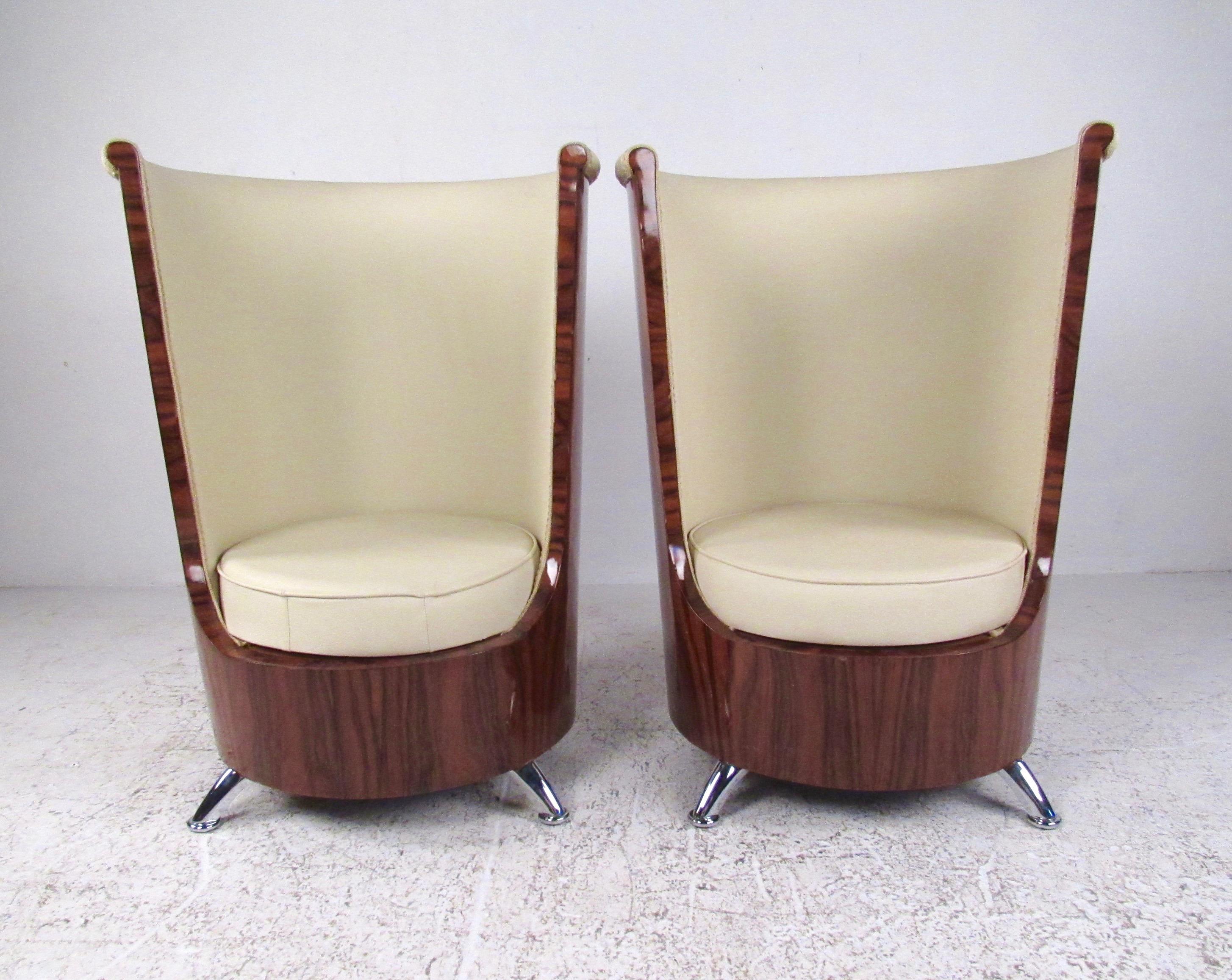 This unique pair of modern deco style barrel back lounge chairs feature a unique lacquered wood finish complimented by faux chrome legs and cream colored vinyl seats. Comfortable and striking Italian modern style makes an impressive addition to home