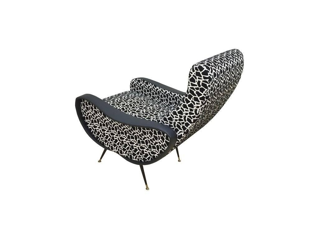 Pair of Italian modern lounge chairs with faux hide upholstery and metal legs. Recently reupholstered.