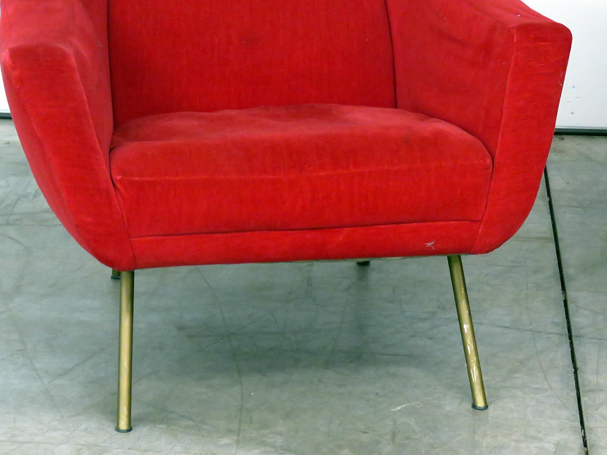 Pair of Gio Ponti style lounge chairs with brass legs.