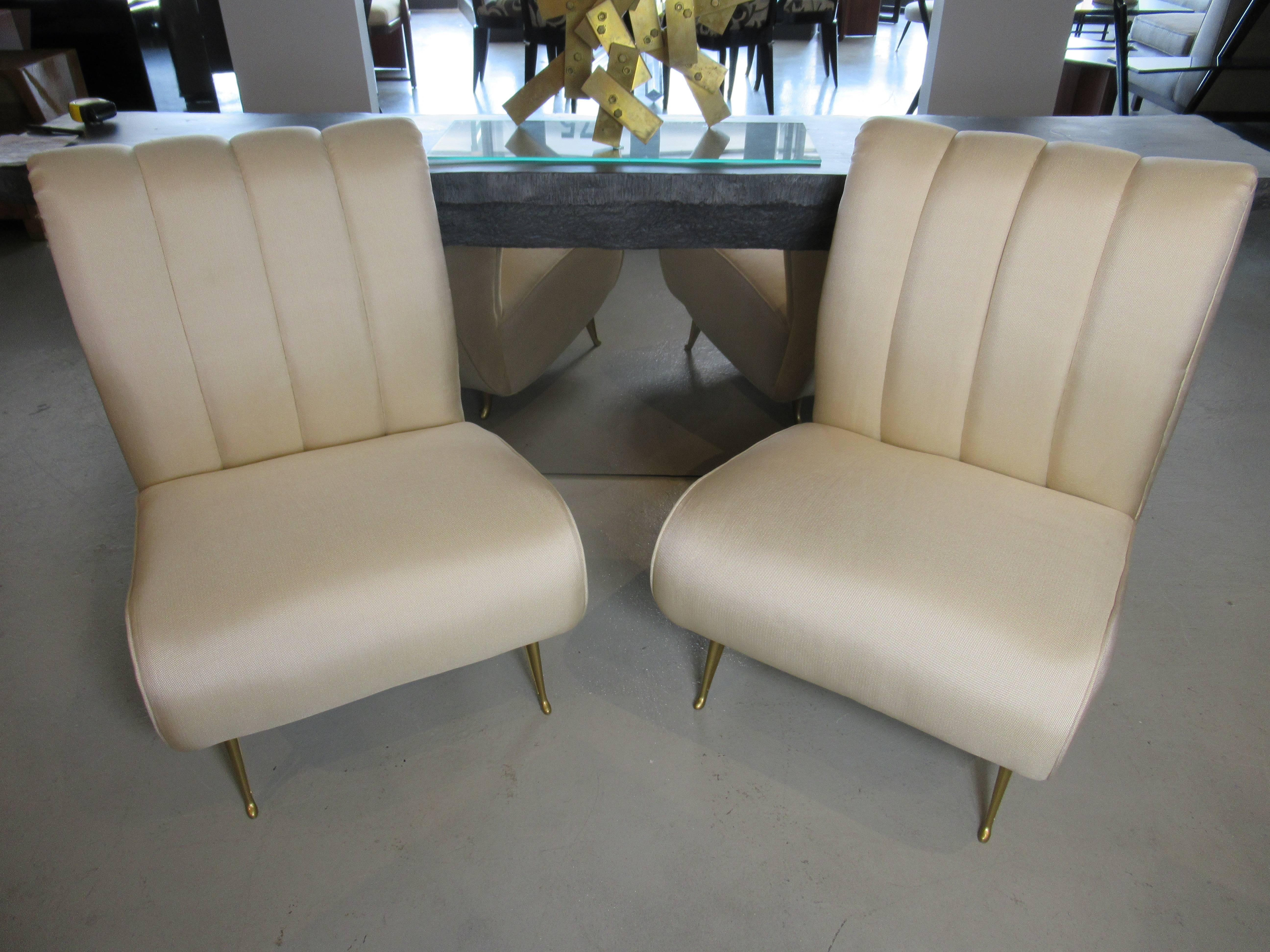 Upholstered slipper chair with channelled back over pierced bronze legs, Gio Ponti for ISA, fully restored. ISA label. These legs for ISA were exclusively used by Ponti and prized for their high quality and design.