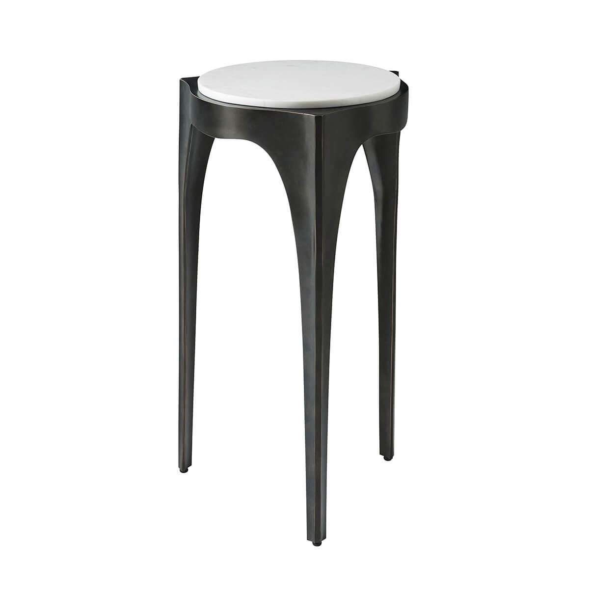 The ideal piece to accompany your relaxation. The raised marble top is set upon an organic three-legged sculptural design and is elegantly featured in a dark Romulous finished metal.

Dimensions: 14.25