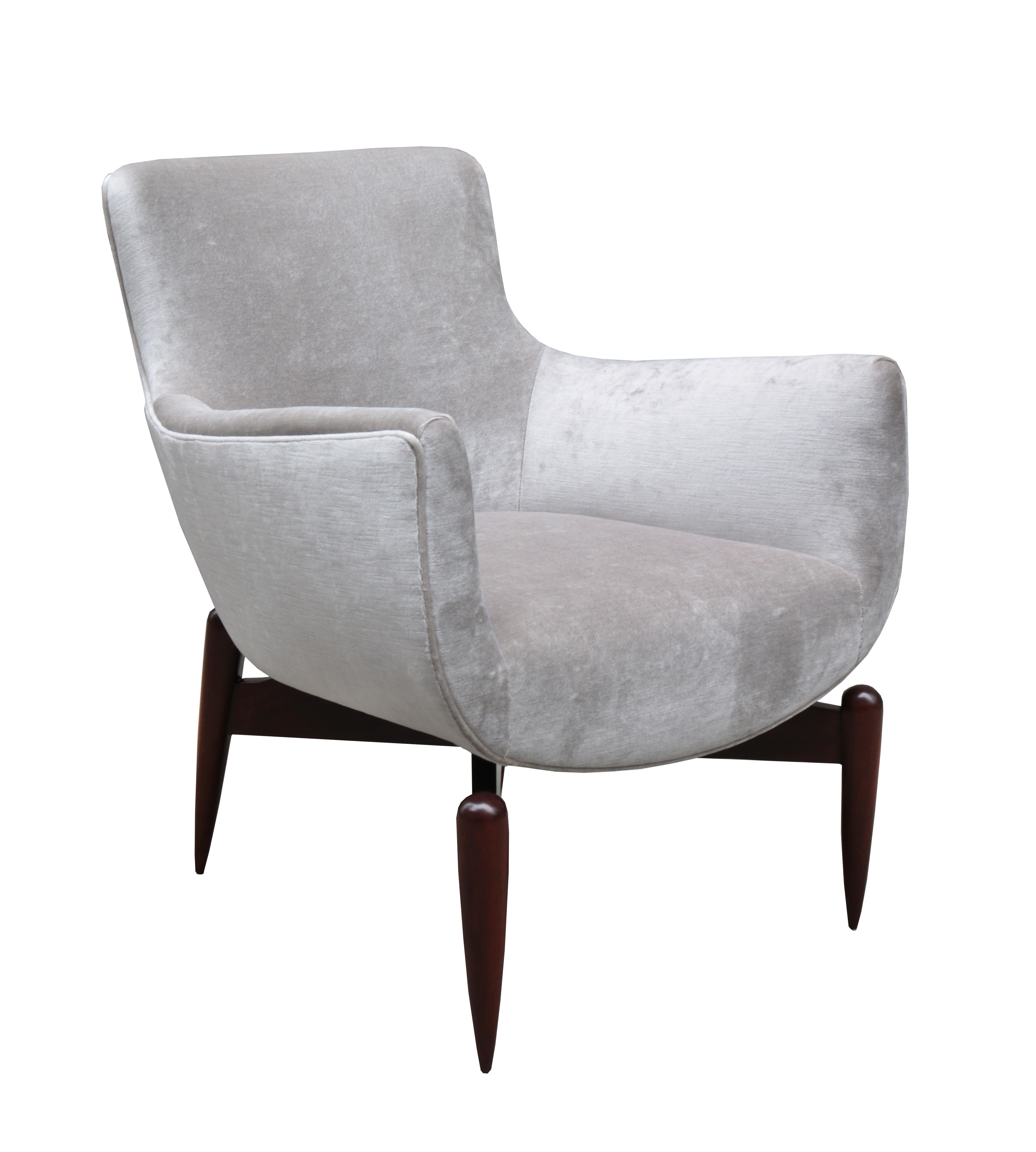 A pair of Italian modernist armchairs.
Upholstered with mahogany legs.
 