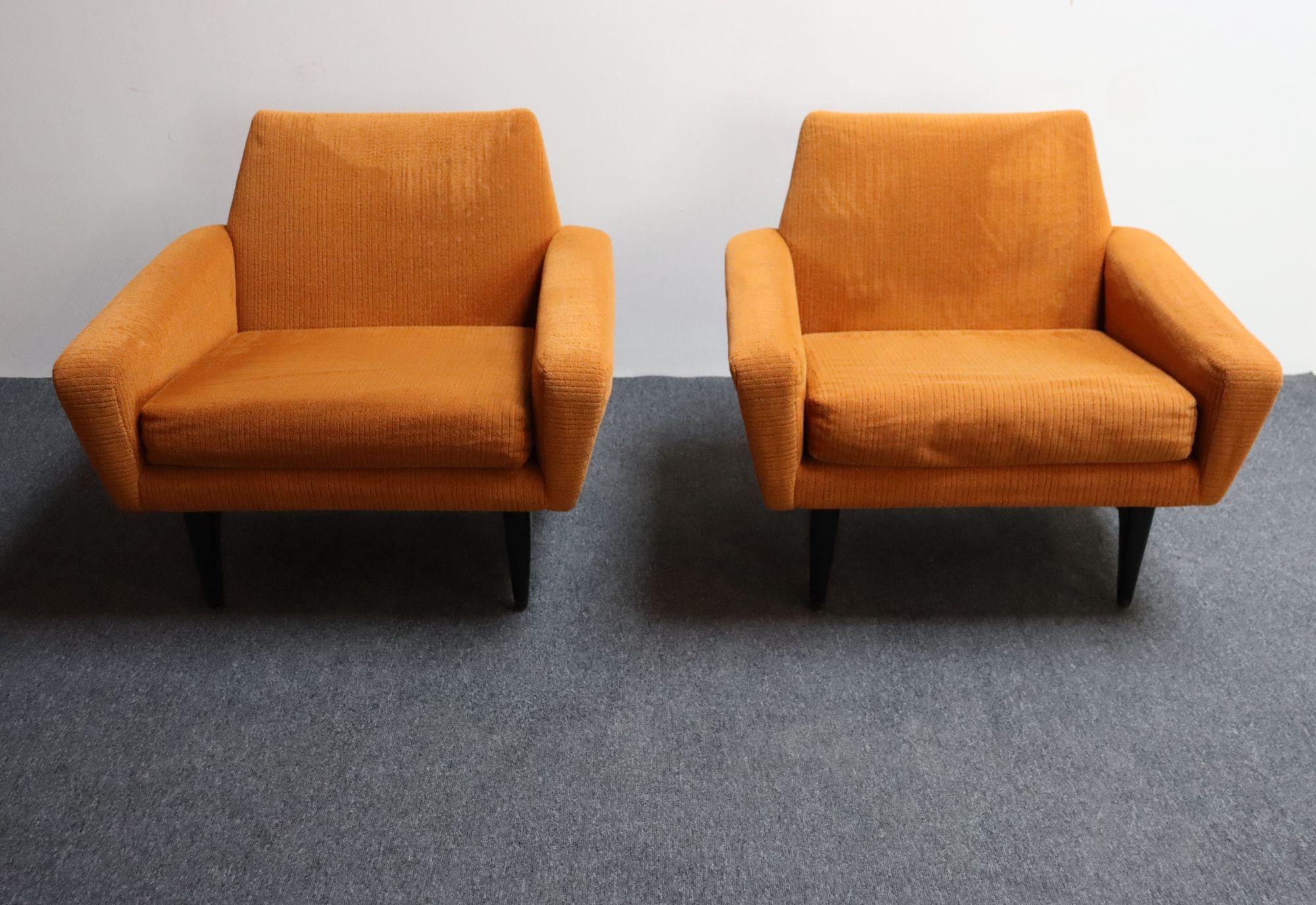Vintage lounge chairs by Pizzetti of Roma (ca. 1960s, Italy).
Composed of low, wide frames supported by deeply sculpted ebonized wooden bases.
The generous seat and arm proportions counterbalance the relatively low profile, offering comfort without