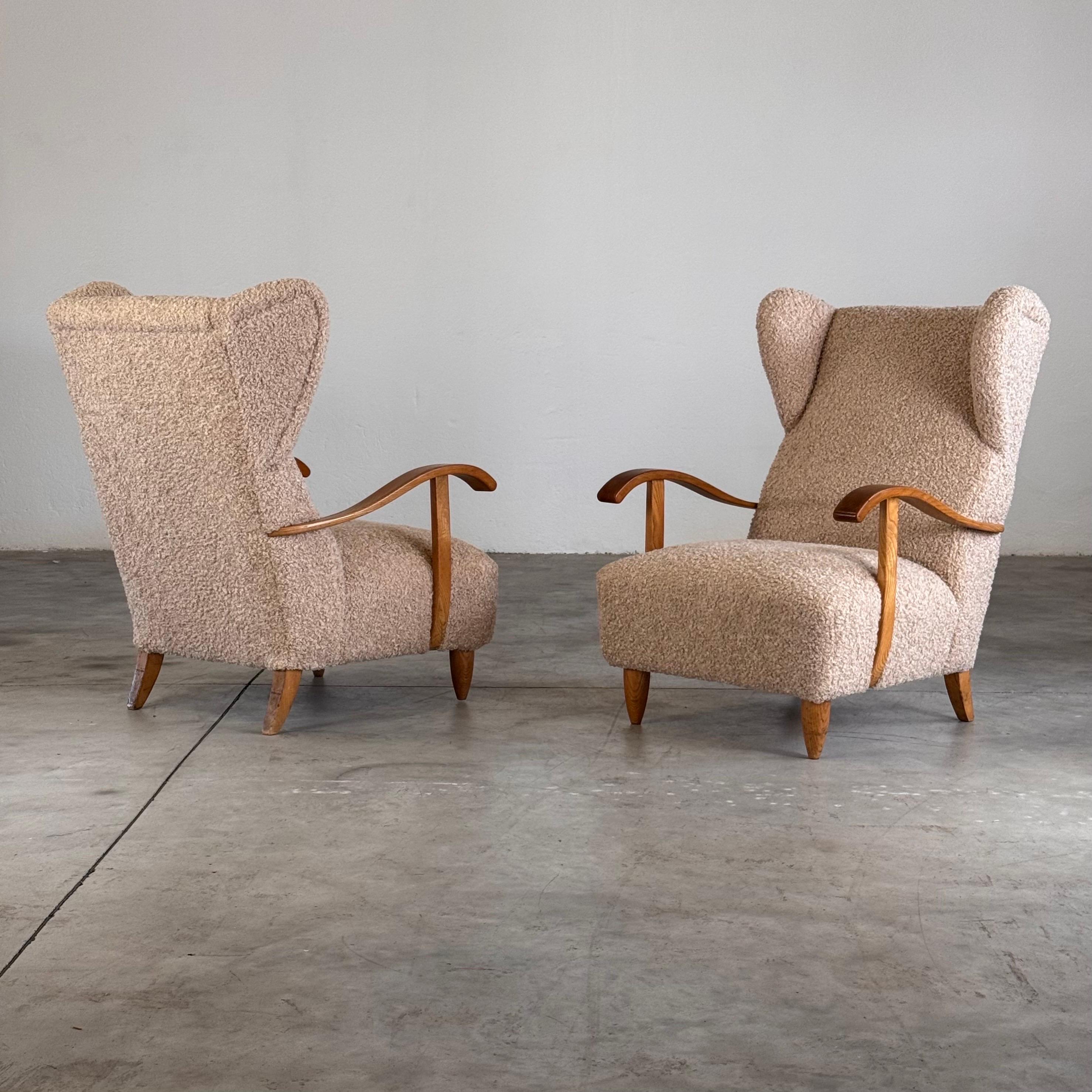A rare and striking pair of highly modernist wing chairs, attributed to Melchiorre Bega and produced in Italy in the 1940s. These chairs showcase a bold, organic design that was truly avant-garde for its time, masterfully balancing sculptural