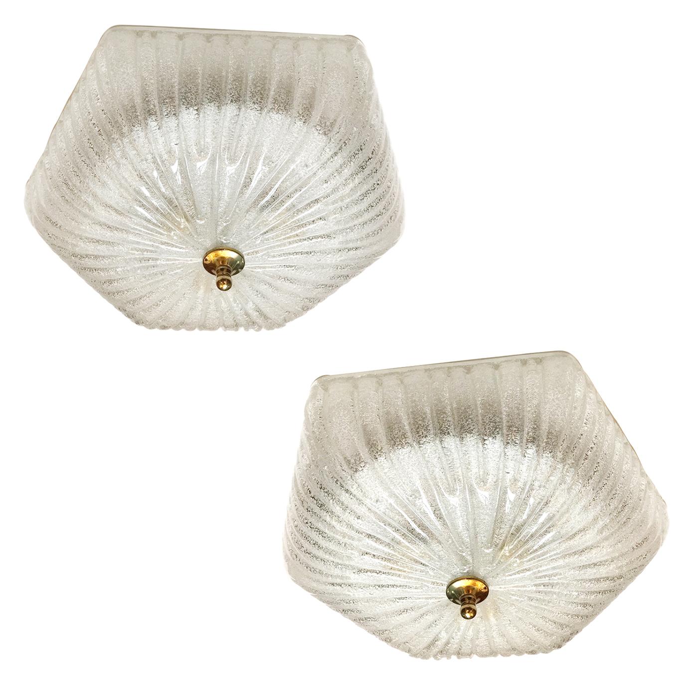 A pair of circa 1960s Italian molded glass flush-mounted light fixtures with interior lights. Sold individually.

Measurements:
Drop 4.5