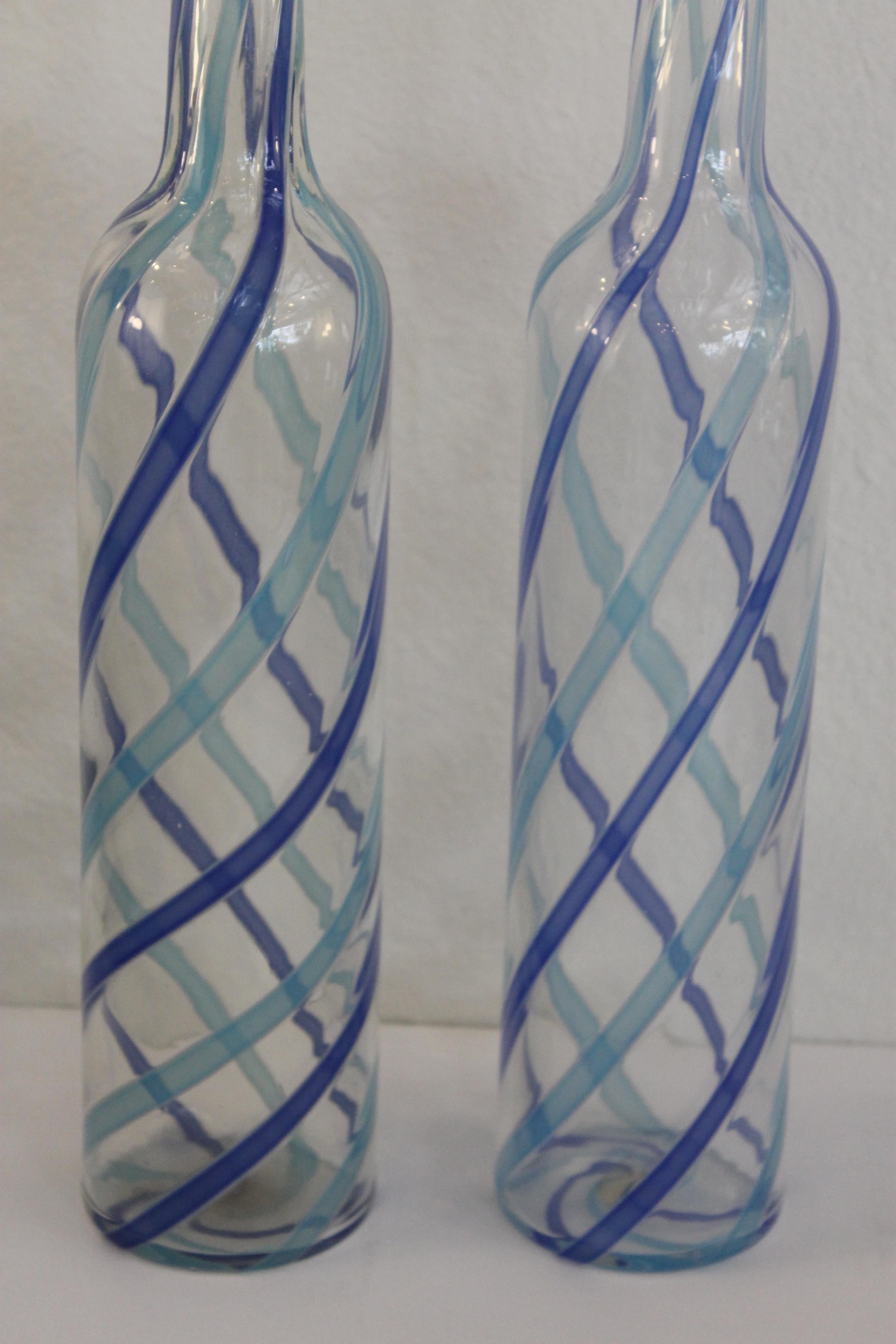 Pair of Fratelli Toso Murano blue and aqua stripe ribbons decanters.  Each vase measures 16.75