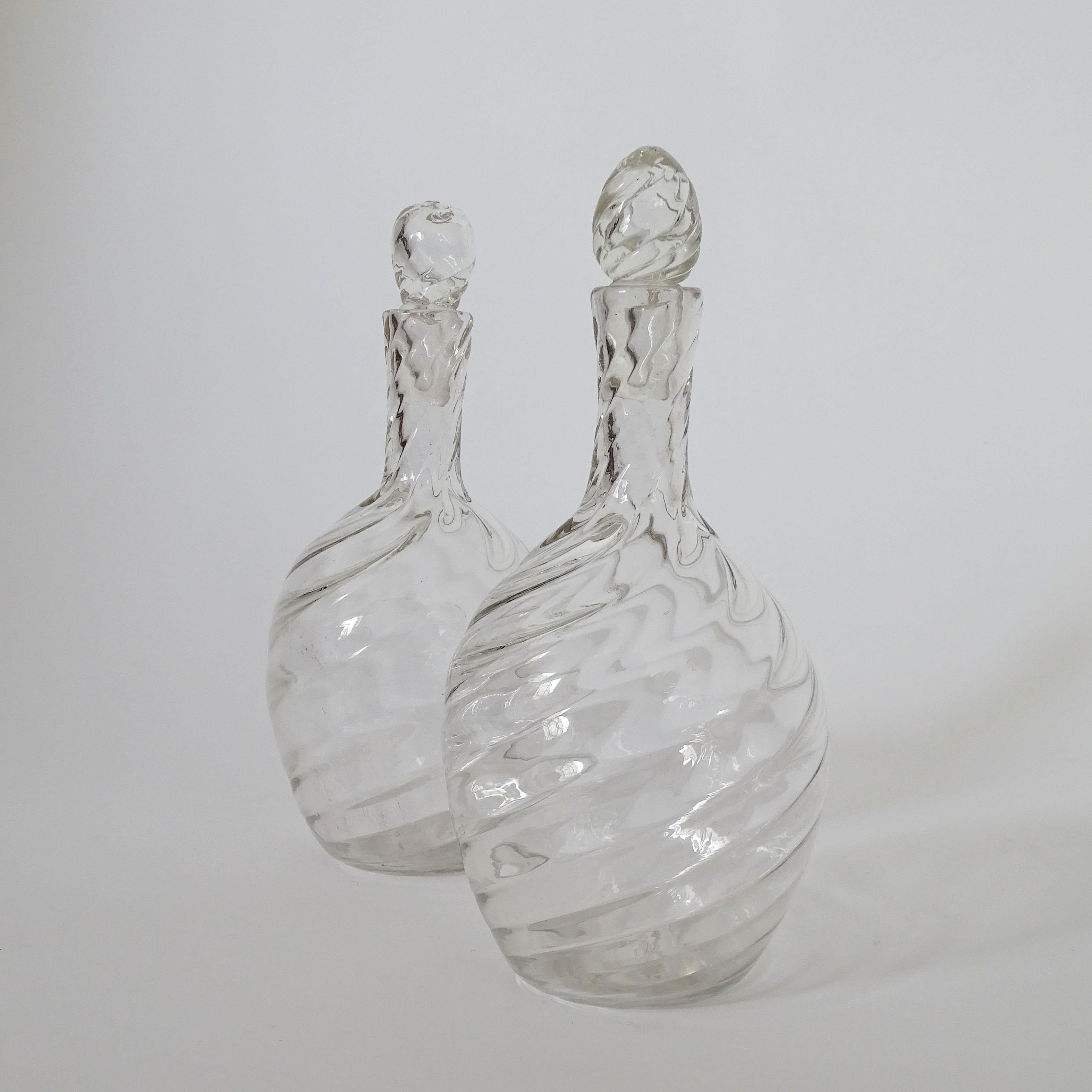 Pair of Italian Murano Glass Decanters in swirling glass and six glasses.