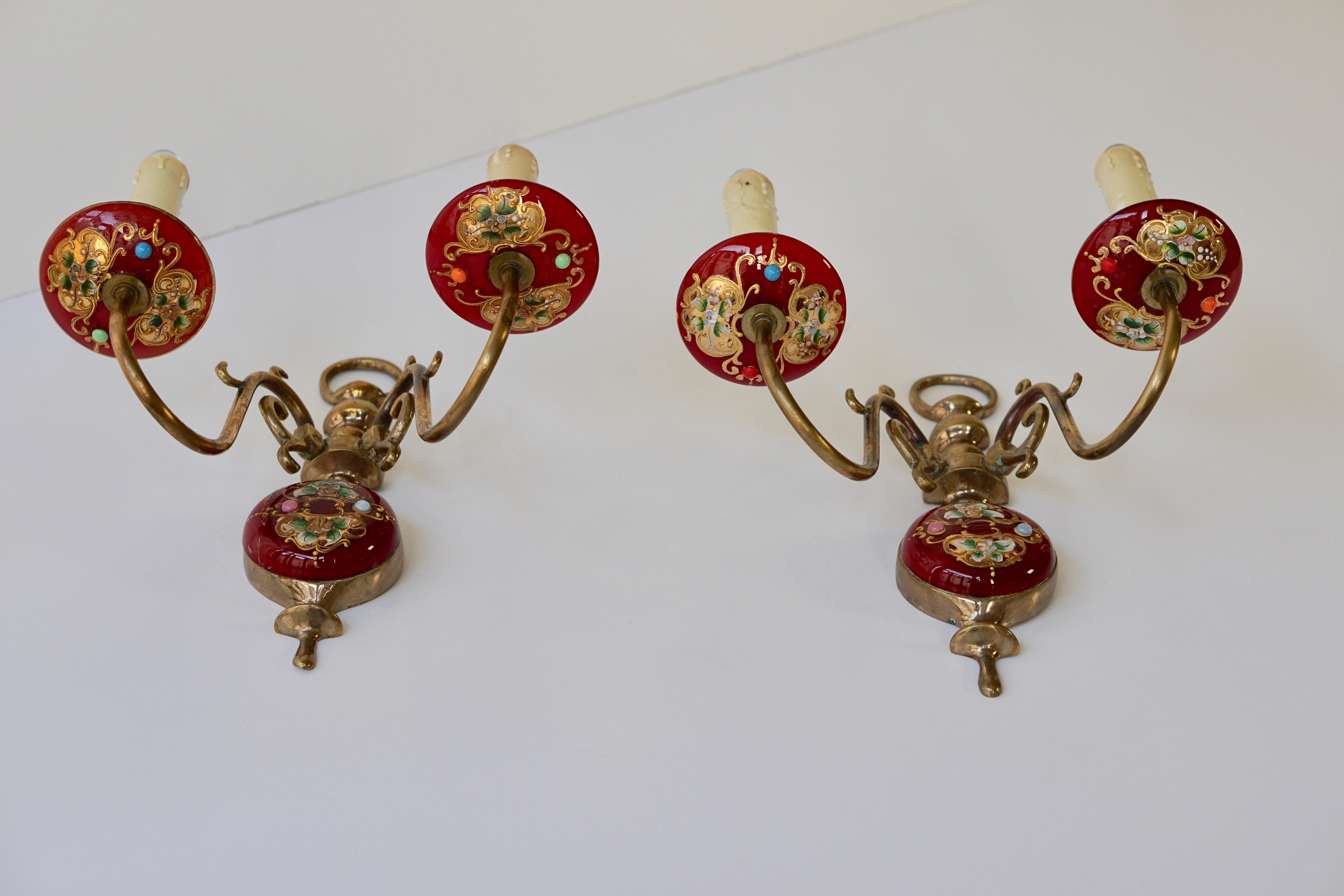 Amazing pair of wall lights with hand blown glass and decorative flowers with brass hardware.
Single based E27 socket per sconce.
Measures: Height 29 cm.
Width 27 cm.

 