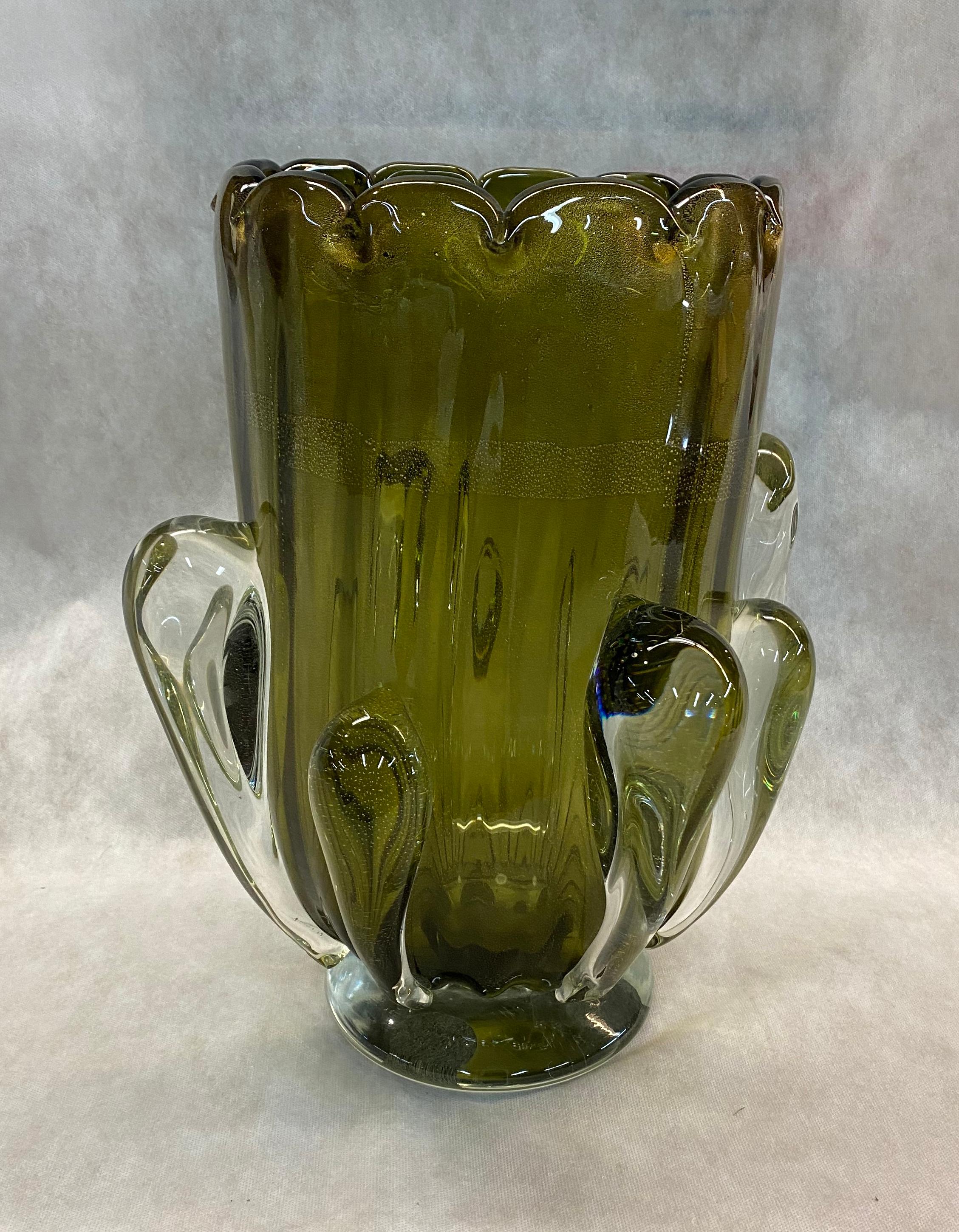 This Italian pair of vases is in translucent olive Murano glass, with gold leaf inclusions decorated with hand applied clear glass drops. Signed in the bottom,

Made in Italy, circa 1970.