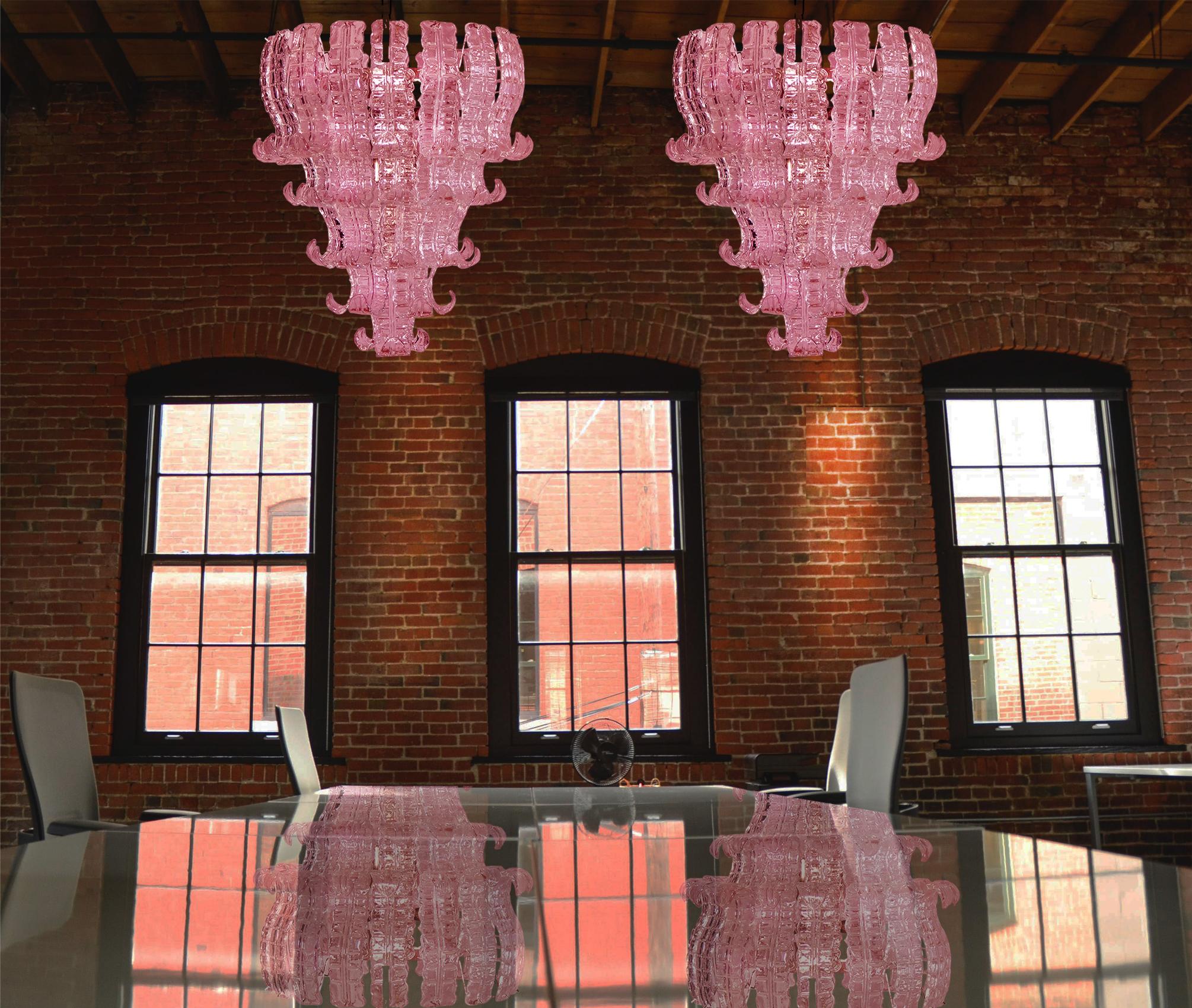 Beautiful and huge pair of Italian Murano chandeliers composed of 52 splendid pink glasses that give a very elegant look
Period: 1970s
Dimensions: 55.10 inches (140 cm) height with chain, 31.50 inches (80 cm) height without chain, 27.55 inches (70