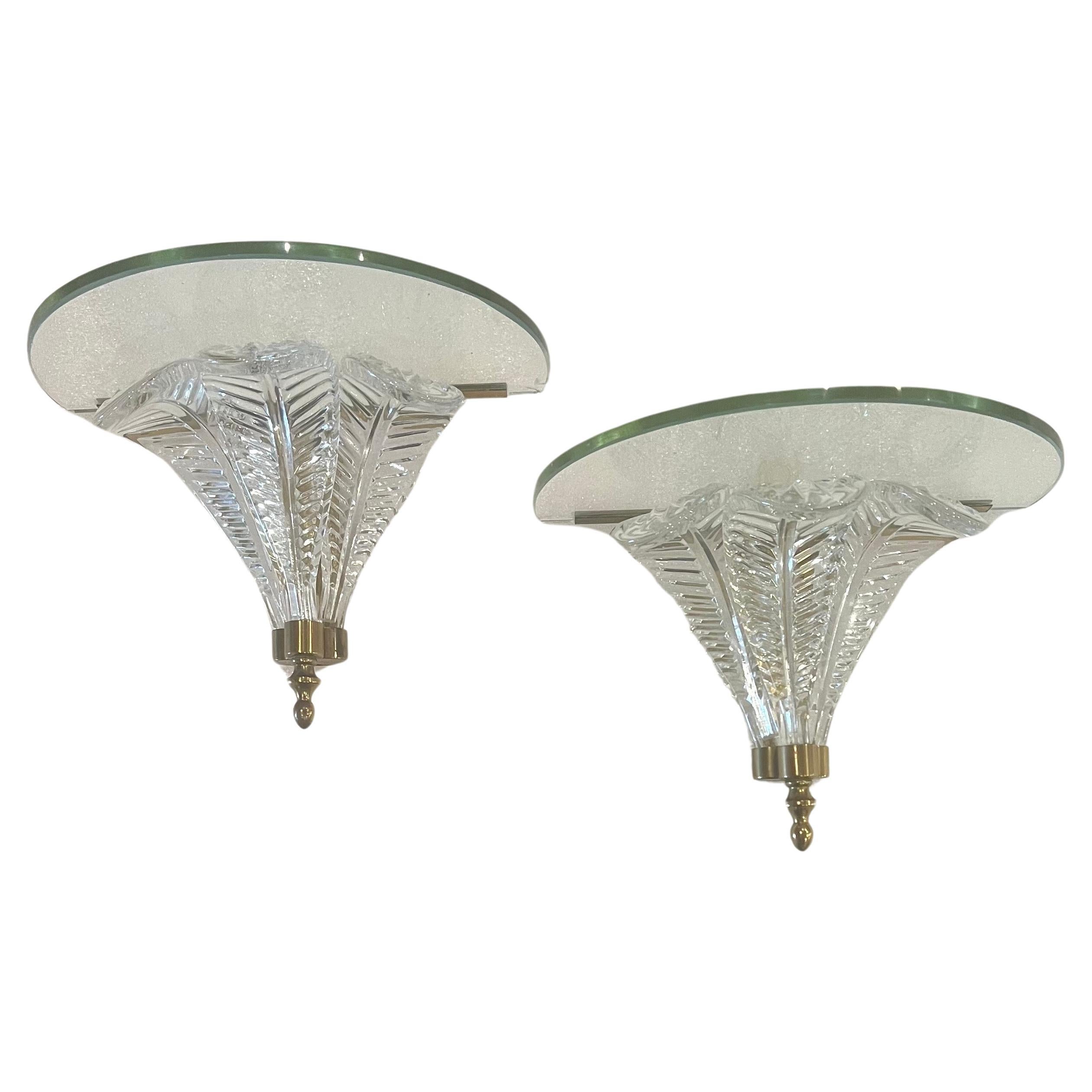 Elegant pair of wall sconces shelves with brass accents petite size beautiful elegant, circa 1970's made in Italy, nice condition small corner chip in one corner on one shelf hard to notice but needs to be mentioned. Sold AS/IS.