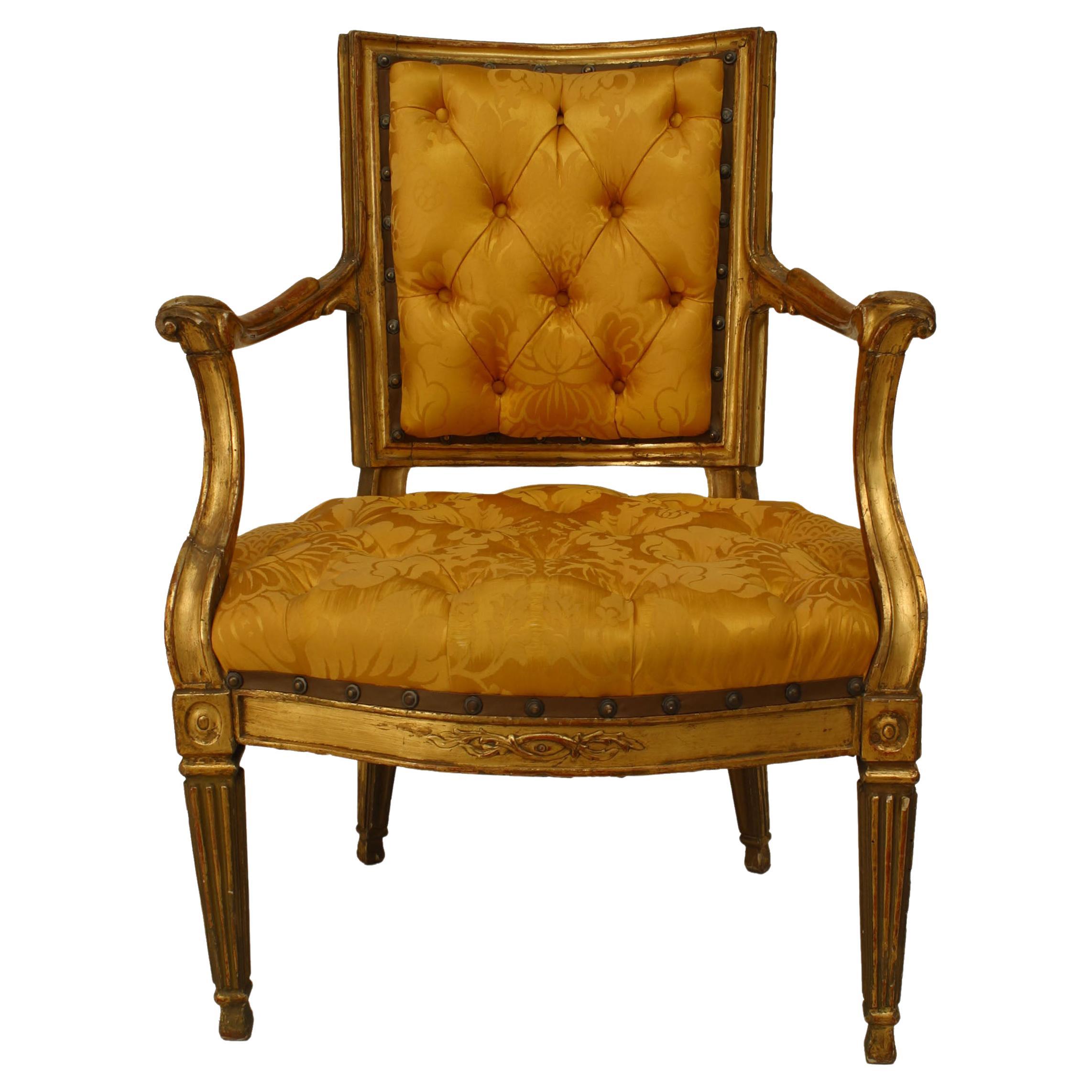 Pair of Italian neo-classic (Neopolitan 18th Cent) open Armchairs with square fluted tapered legs and carving on backrail with gold upholstered seat and back.
 