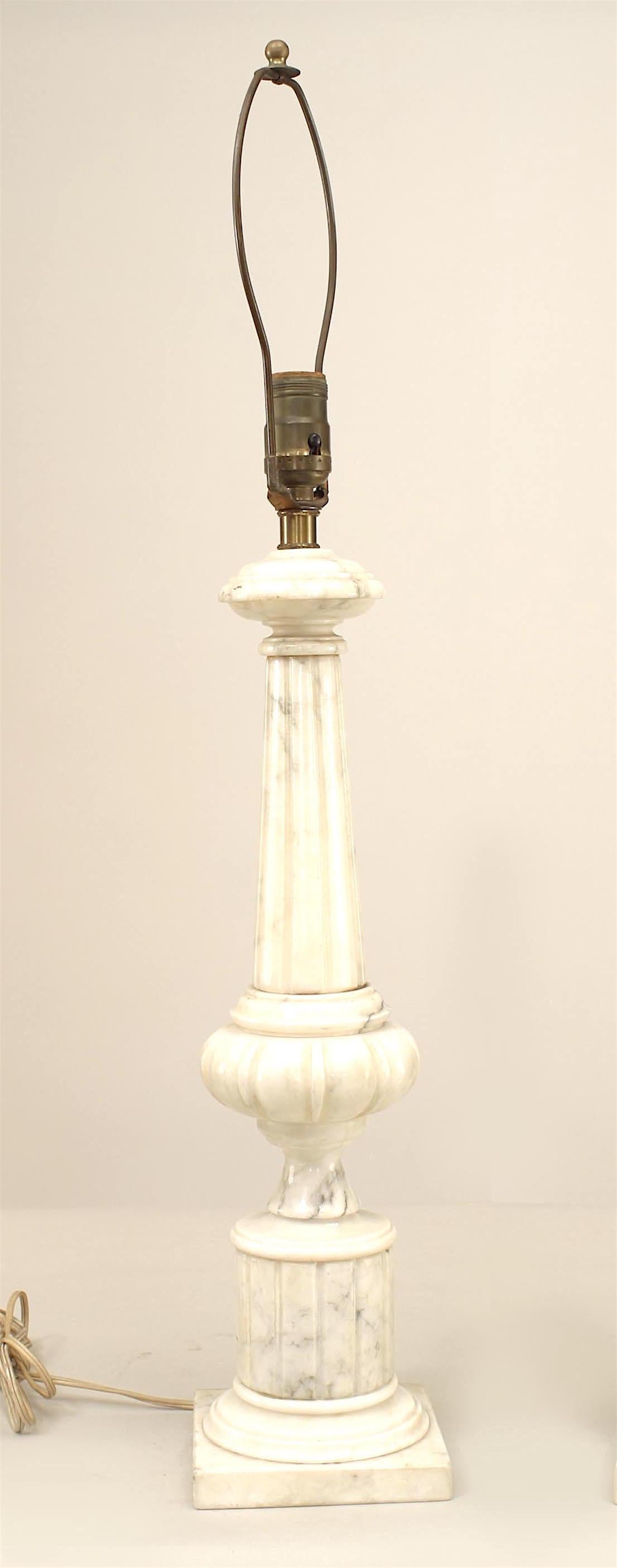 Pair of Italian Neo-classic style (20th Century) white alabaster lamps with a fluted column design supported on a square base (PRICED AS Pair).
