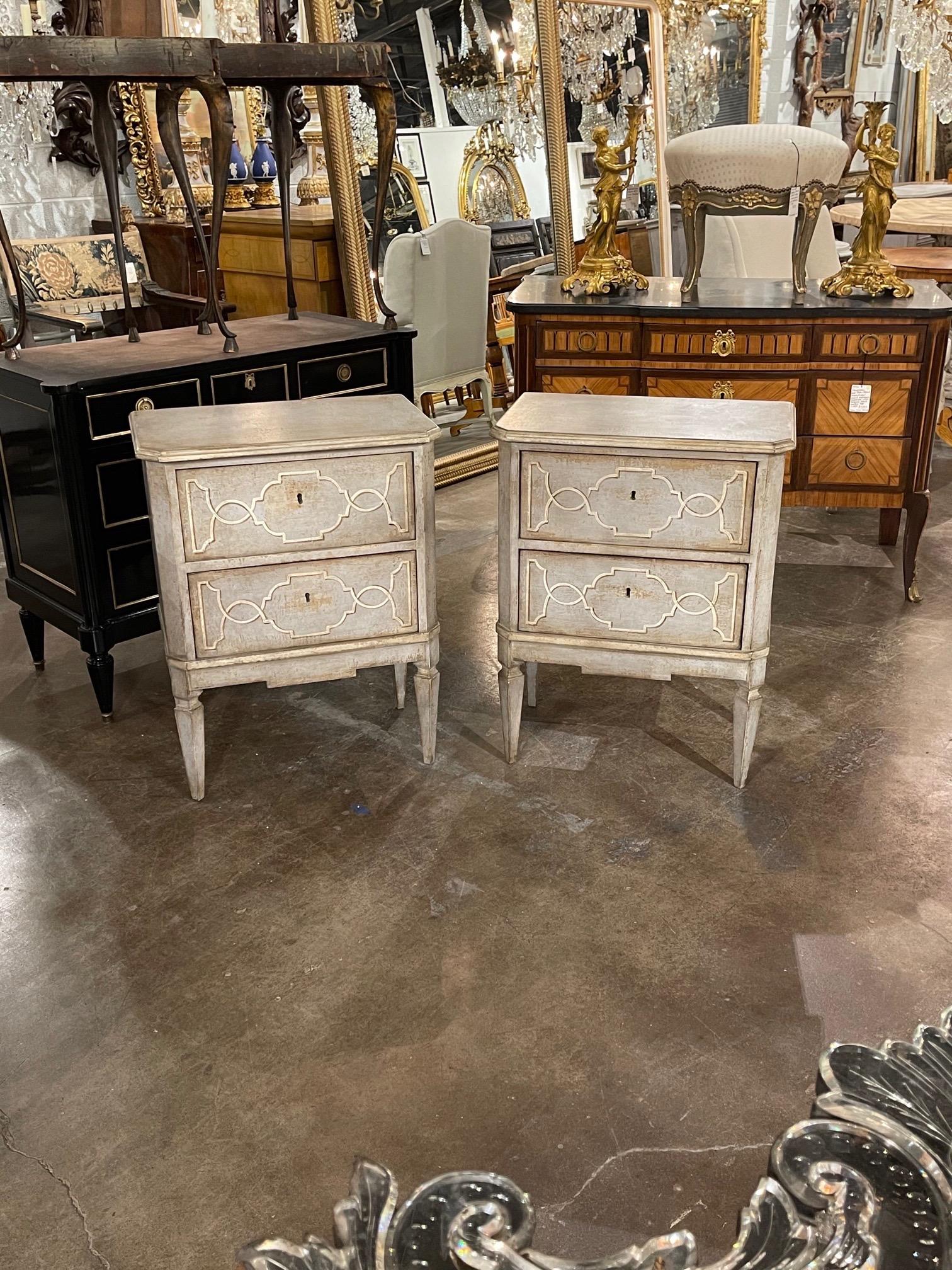 Fabulous pair of Italian neoclassical style hand painted bed side tables. Beautiful bluish patina and pretty painted pattern. Mixes well with a variety of decors!