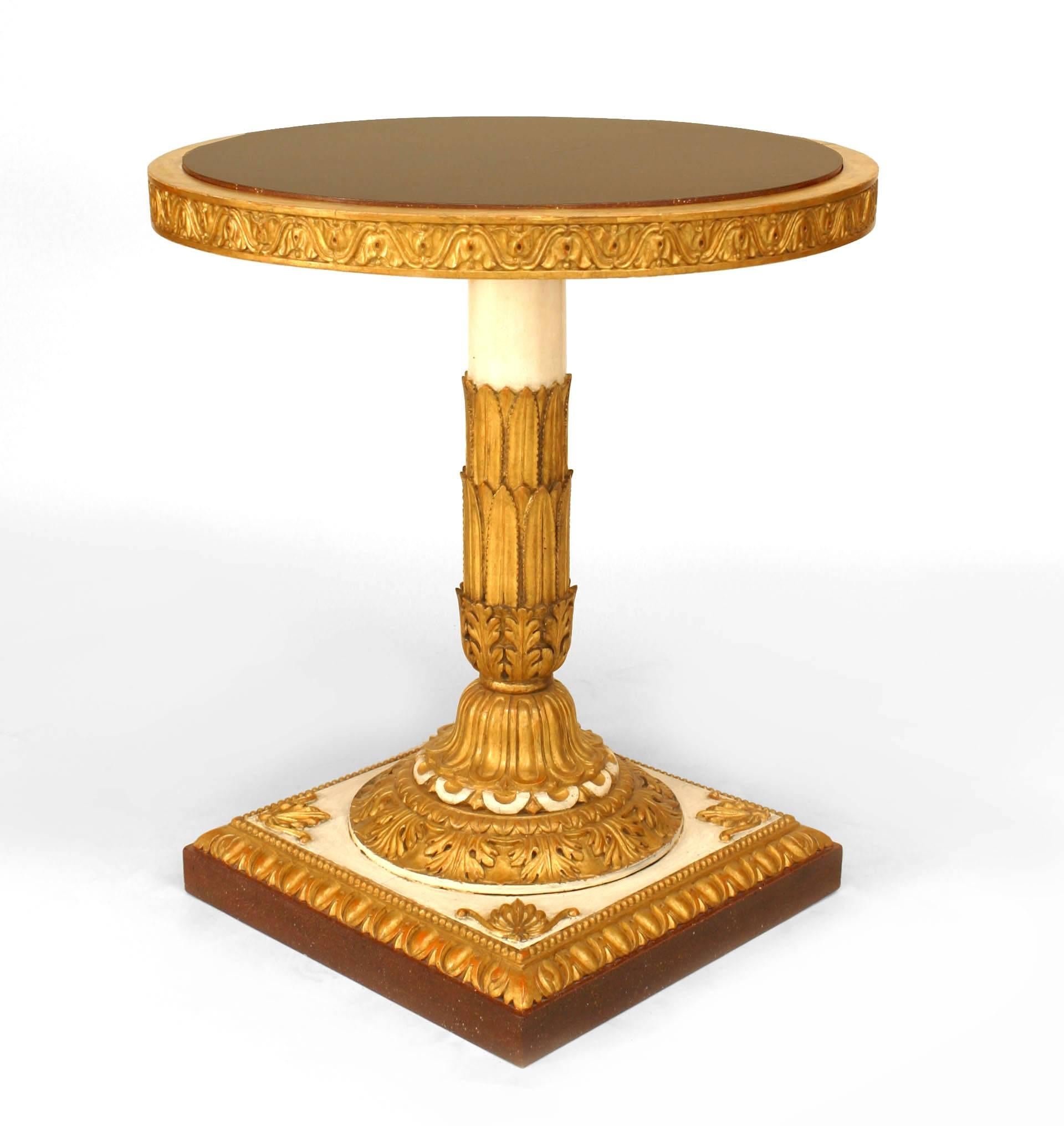 Pair of Italian Neo-classic (19th Century) white painted and gilt carved pedestal end tables with a round inset faux porphyry top and trimmed edge of a square base (PRICED AS Pair)
