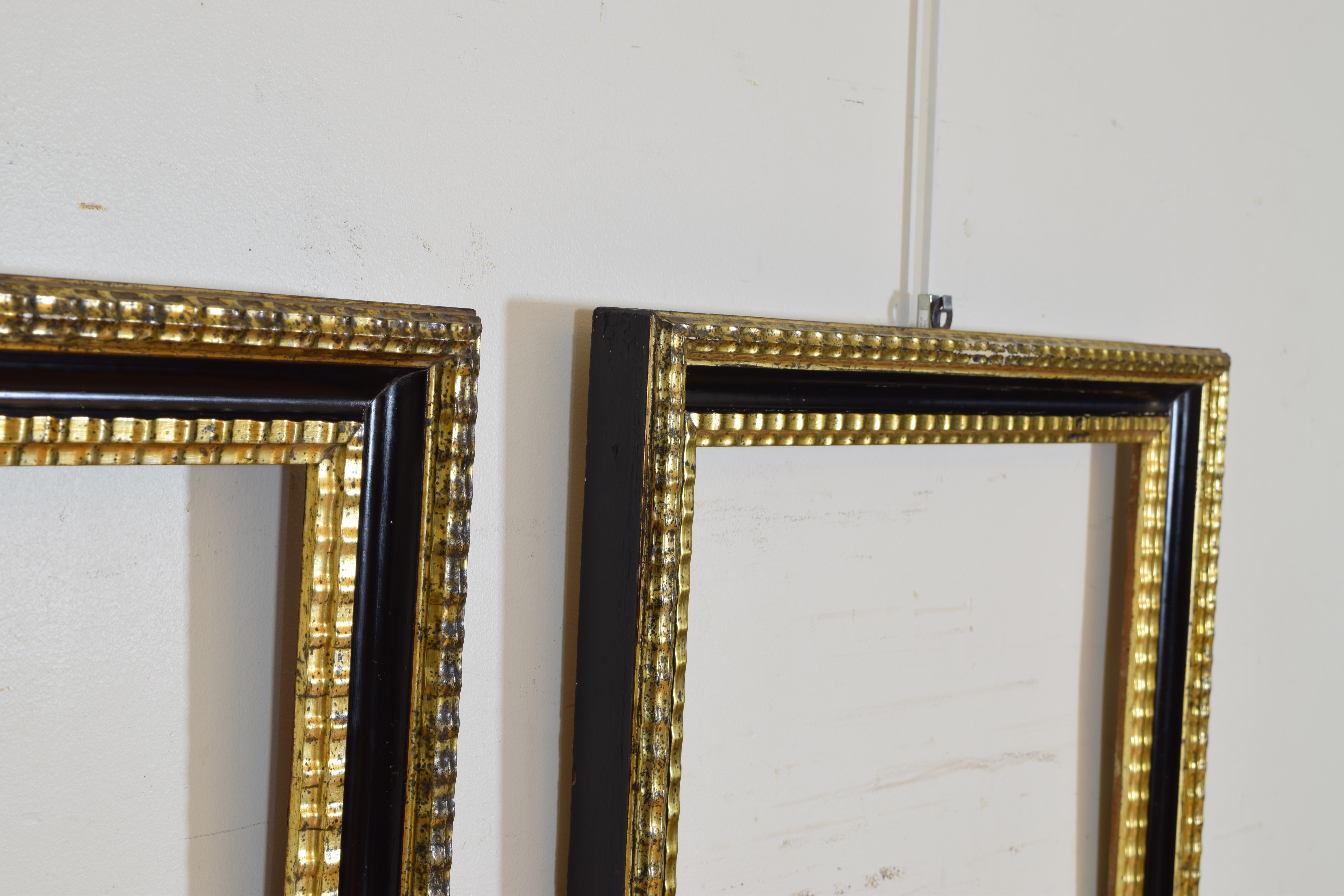 Pair of Italian Neoclassic Ebonized and Giltwood Mirrors In Excellent Condition In Atlanta, GA
