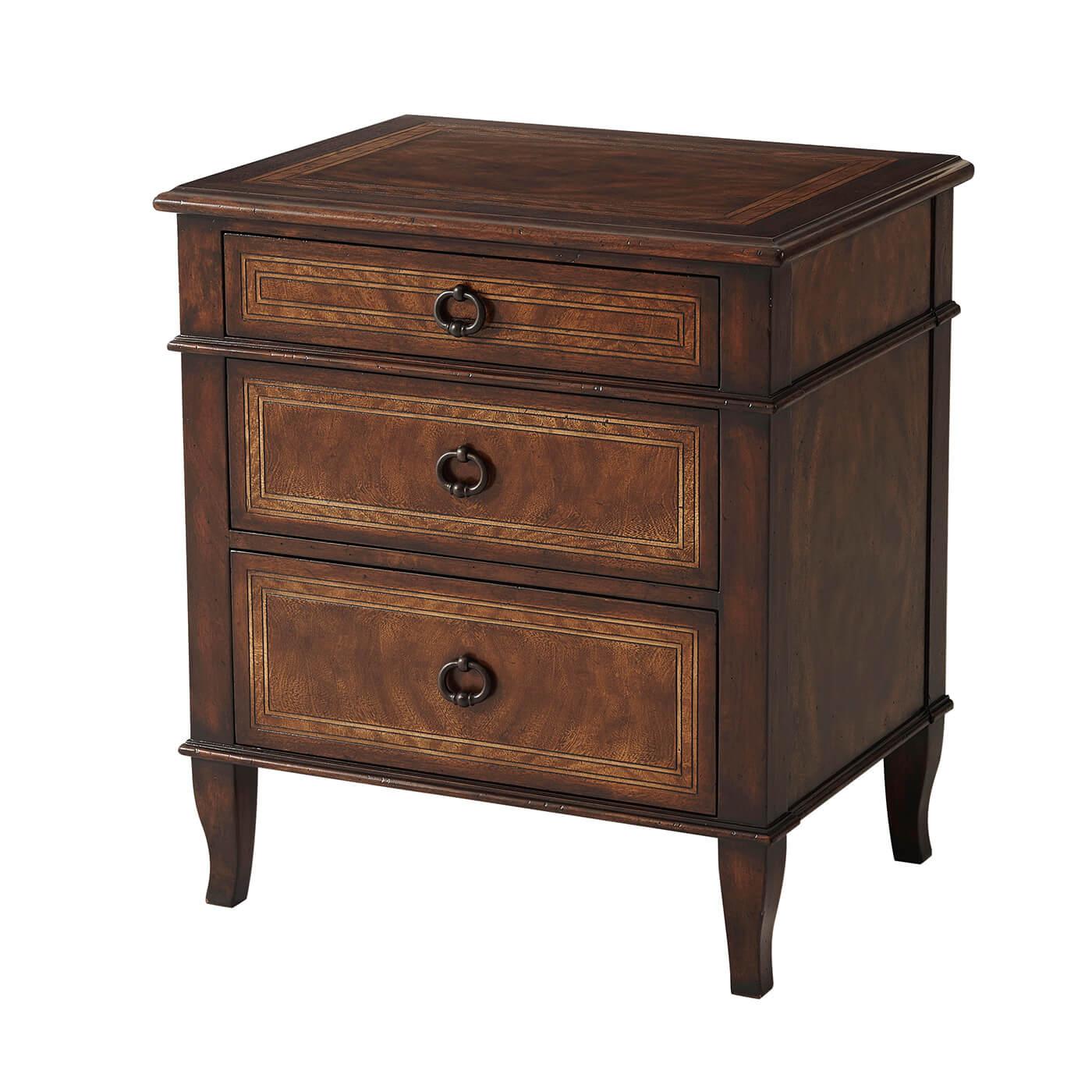 An Italian NeoClassic mahogany bedside commode or nightstand, the rectangular crossbanded top above three graduated drawers, on splayed legs.
Dimensions: 27