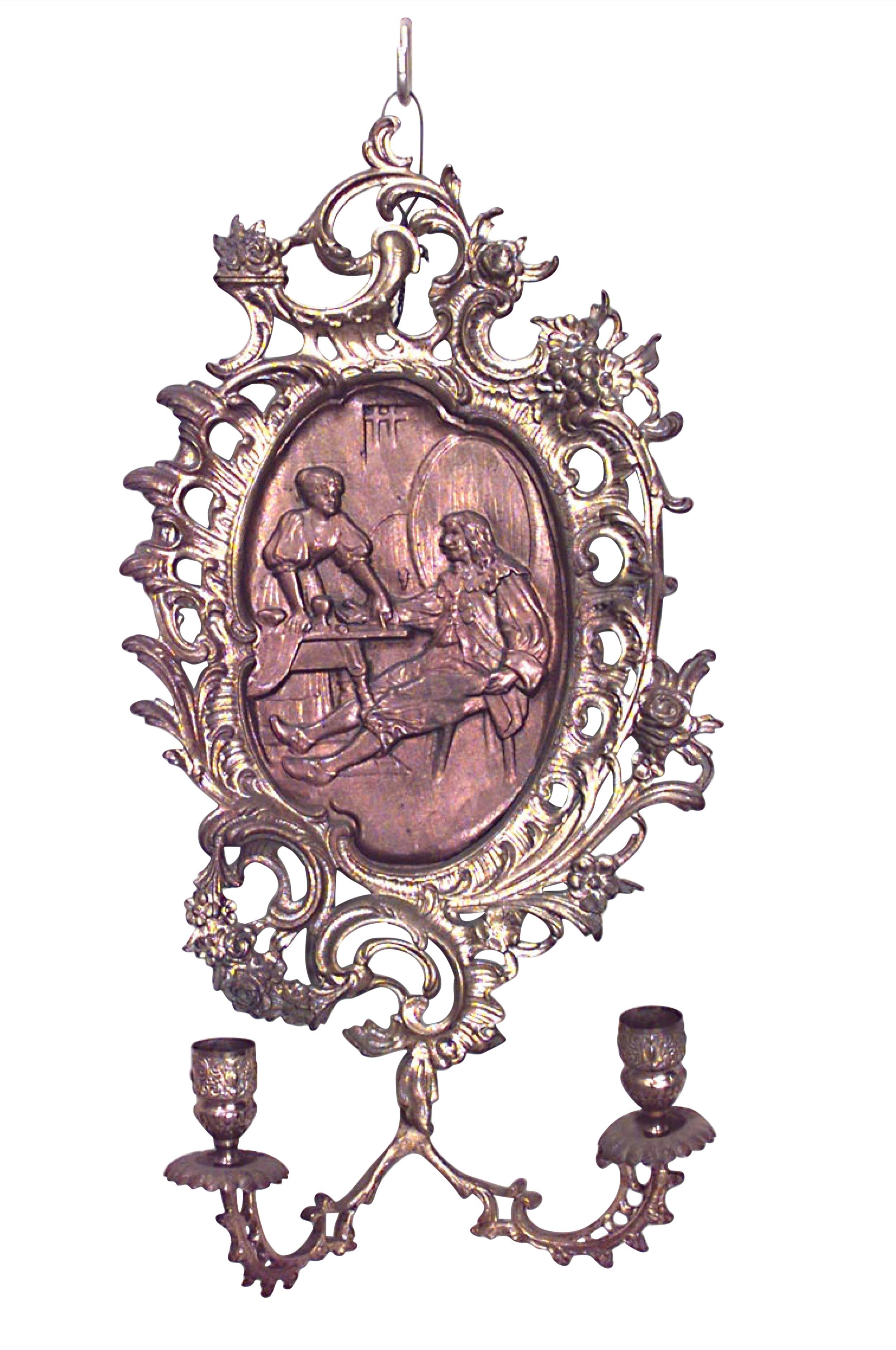 PAIR of Italian Neoclassic-style (19/20th Century) bronze and dore wall sconces with two arms, filigree edges, and oval relief center panels. (PRICED AS PAIR)