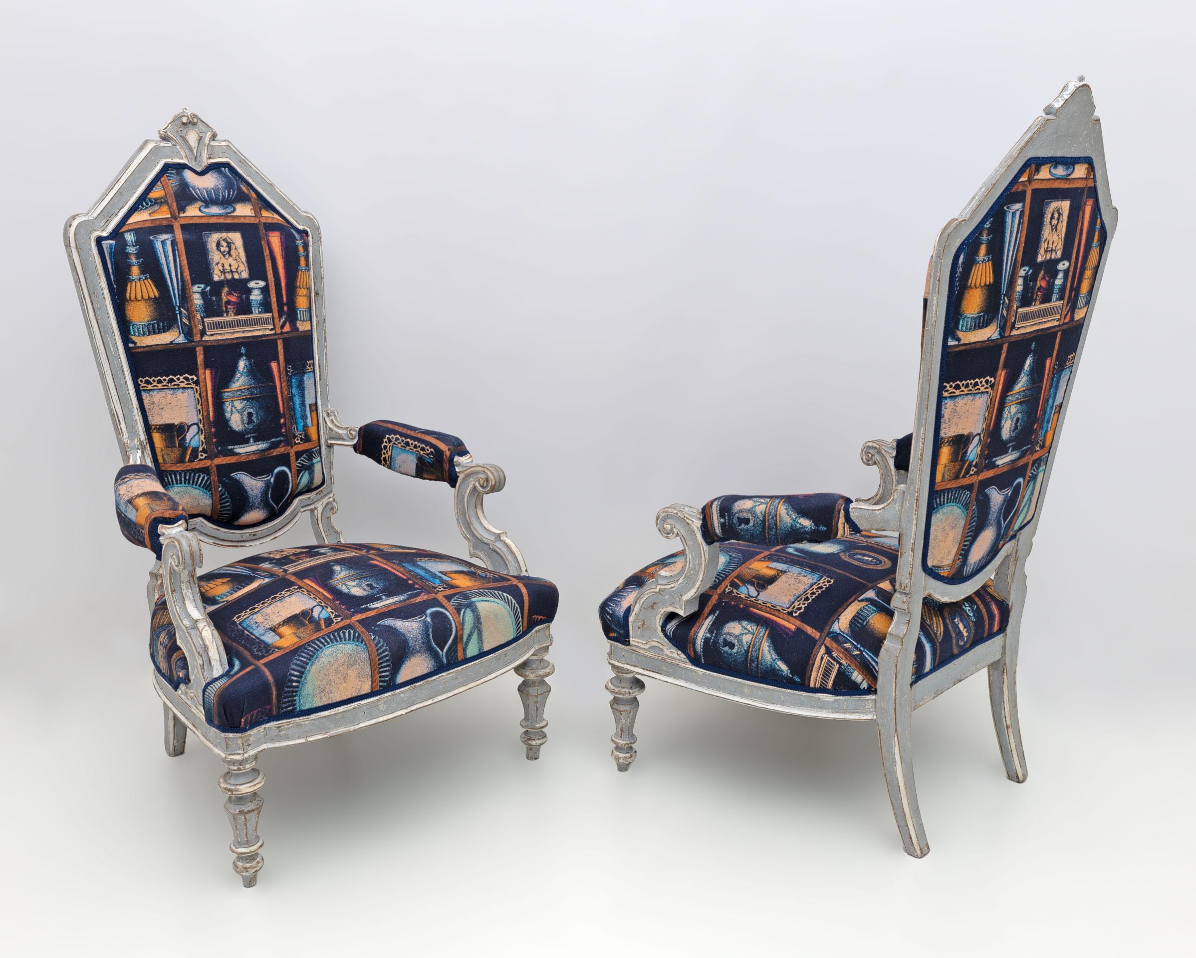 This pair of neoclassical style armchairs come from a nineteenth-century villa on Lake Como, the gray and white lacquered armchairs, shabby chic effect, are covered with original Fornasetti linen fabric, see signature as in the photo.