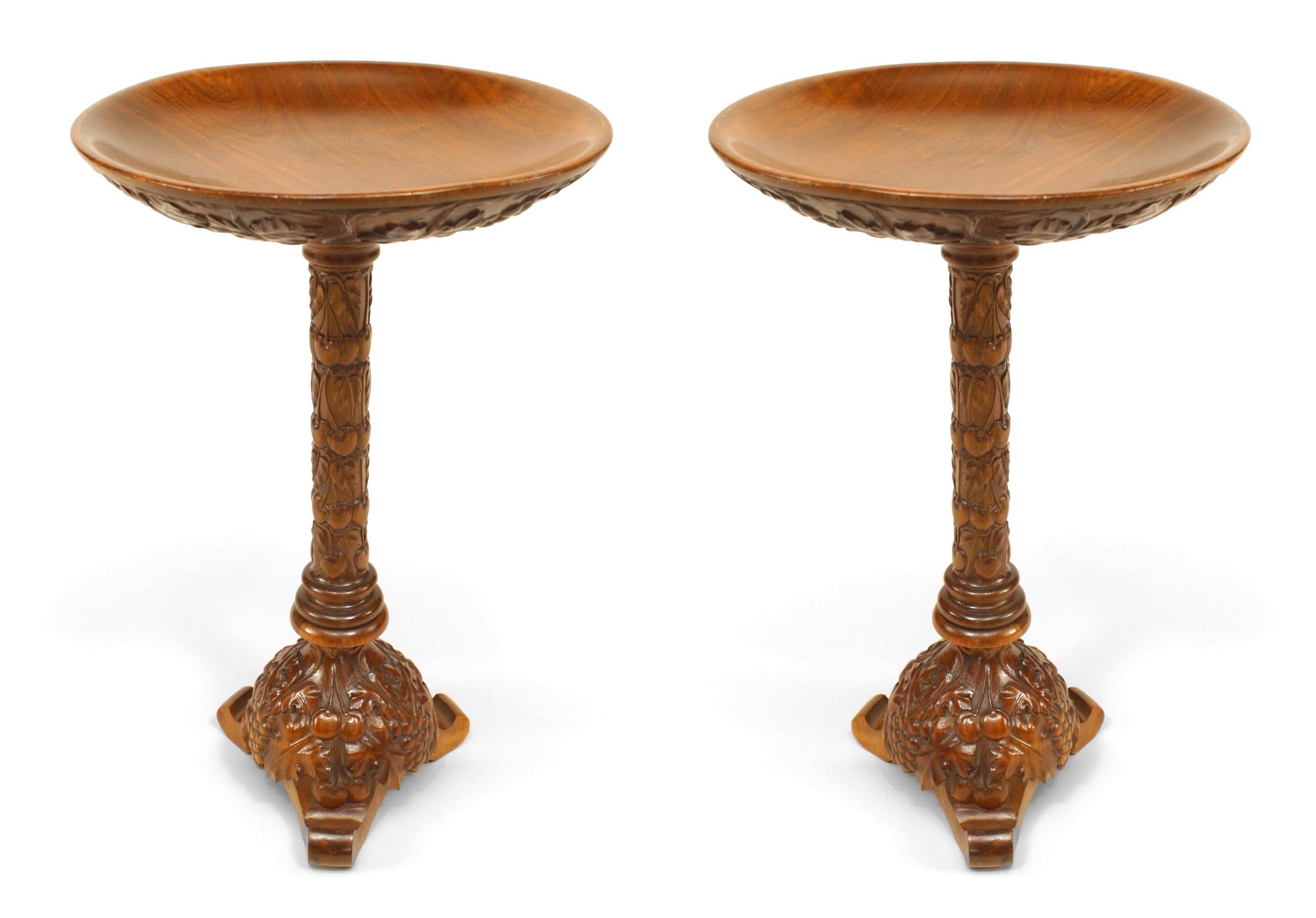 Pair of Italian neo-classic-style (19/20th Century) walnut low end tables (stands) carved with a floral and grape design and having a bowl form top. (PRICED AS Pair).
 