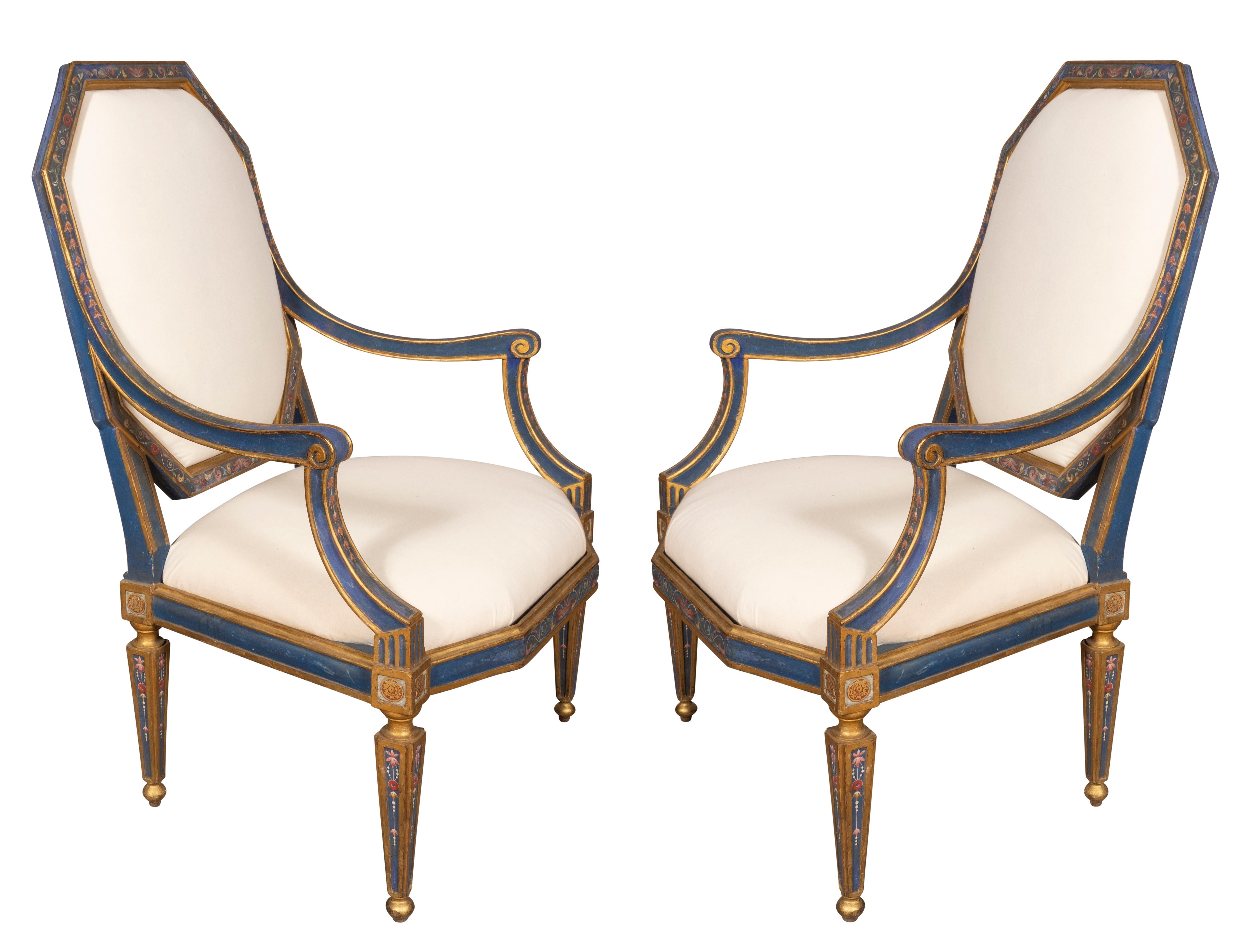 A fine pair of chairs with unusual shaped backs and seats. With blue paint, gilding and Etruscan painted decoration. Raised on square tapered legs. Very generous scale and very sturdy. With original paint and newly upholstered removable seats.