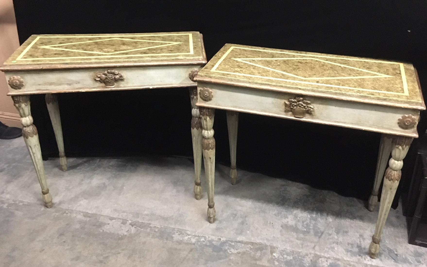 Truly lovely pair of Italian neoclassical parcel-gilt and celadon green paint decorated console, late 18th century.
The celedon green faux painted marble tops over beige rectangular frieze centered by parcel gilt floral bouquet and flanked by
