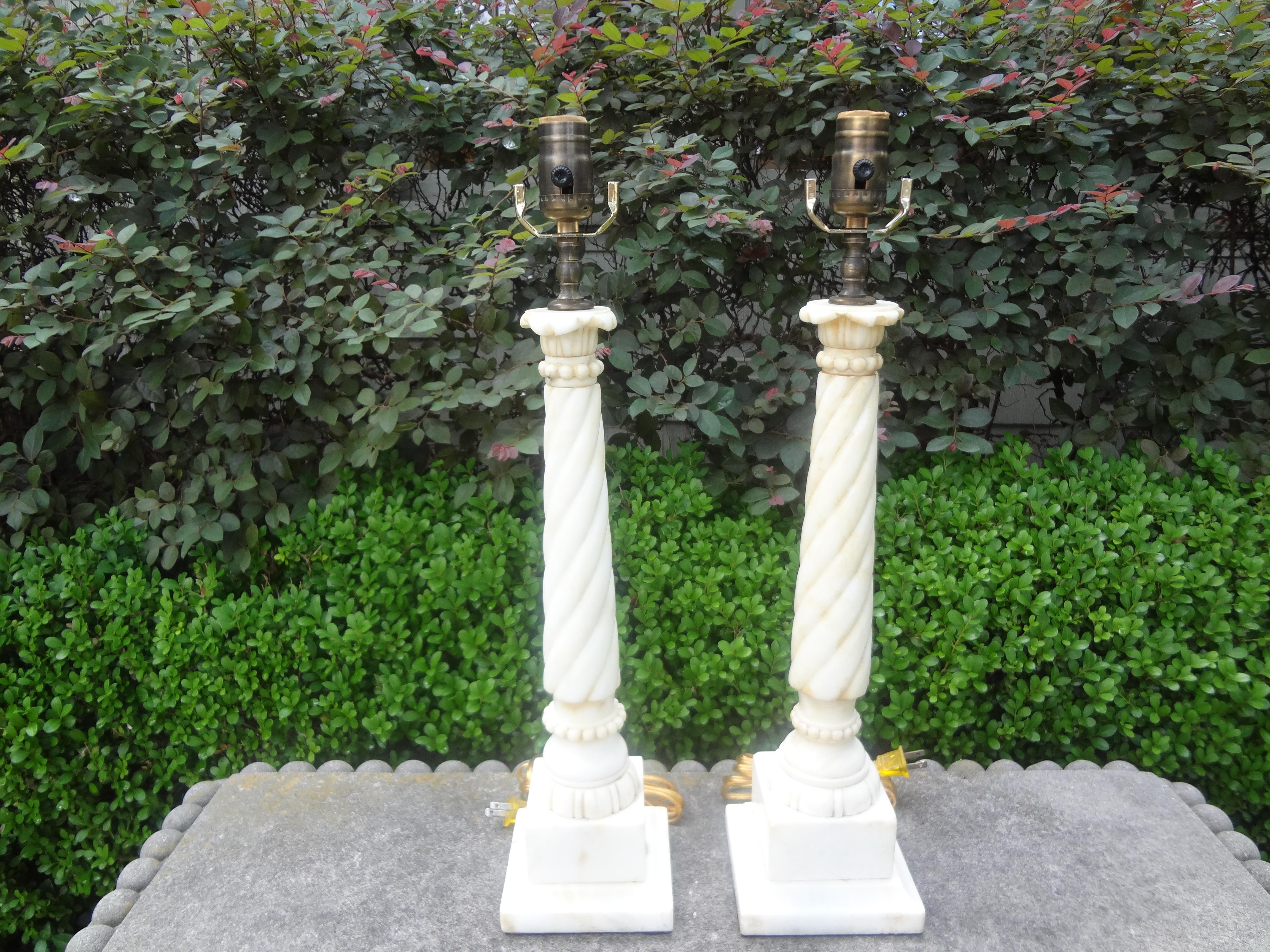 Great pair of vintage Italian neoclassical style Corinthian column alabaster lamps. This versatile pair of Italian column lamps have been newly wired to U.S. specifications and would work well in a variety of interiors.