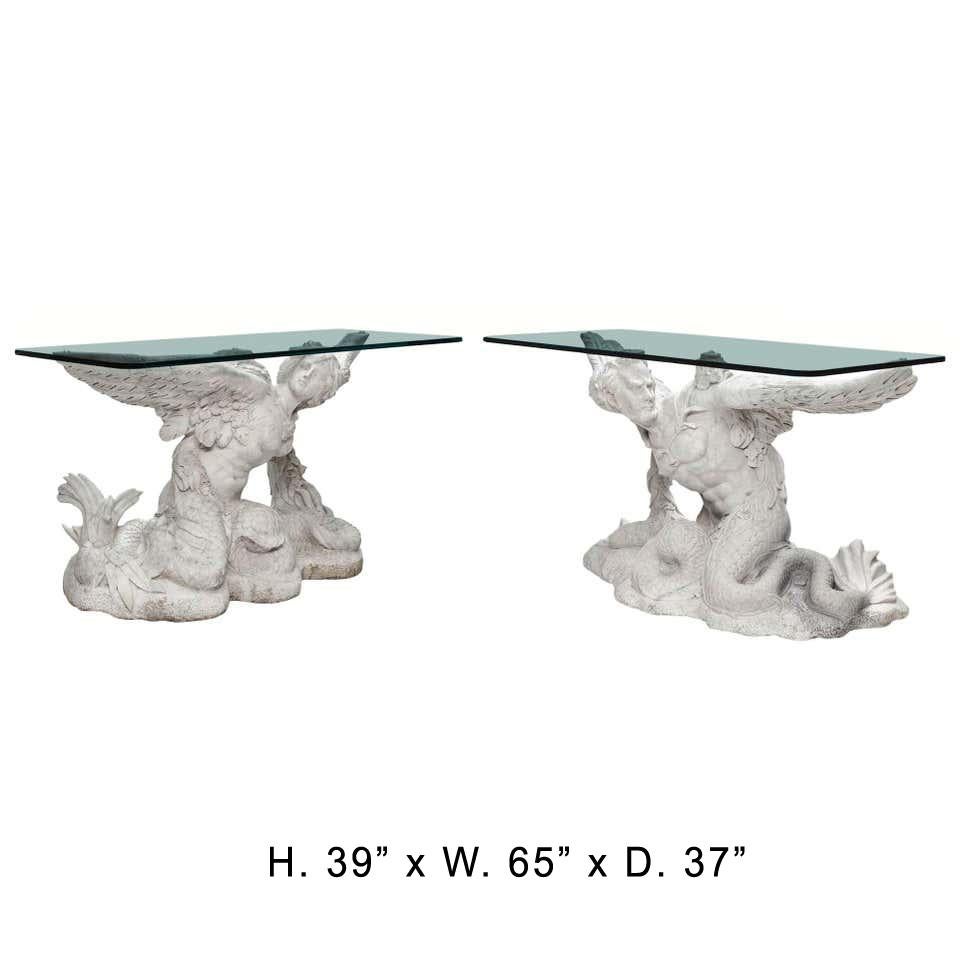 Exquisite and unique pair of Italian neoclassical style hand carved white marble consoles of Greek Sirens, 20th century. 
A similar console was sold at Sotheby's Auction in 2009. (See attached tear sheet photo)
The thick rectangular glass top is