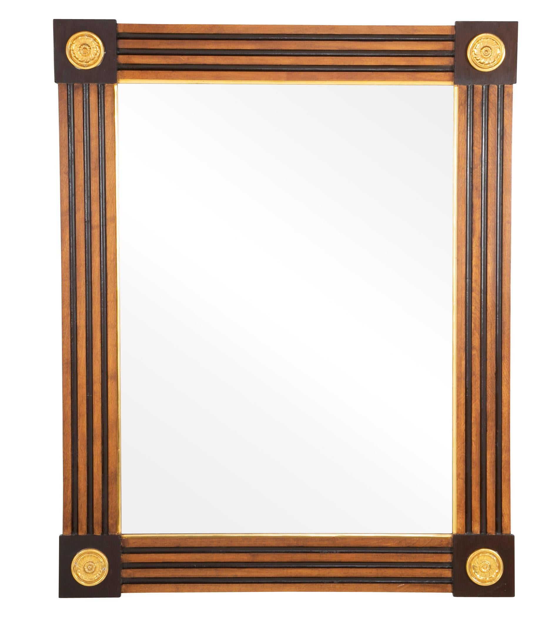 Great looking pair of mirrors in the neoclassical style, the grooved sides meeting at raised square corners with gilt rosettes. Very architectural, midcentury Italian. 

Good scale at 49.75