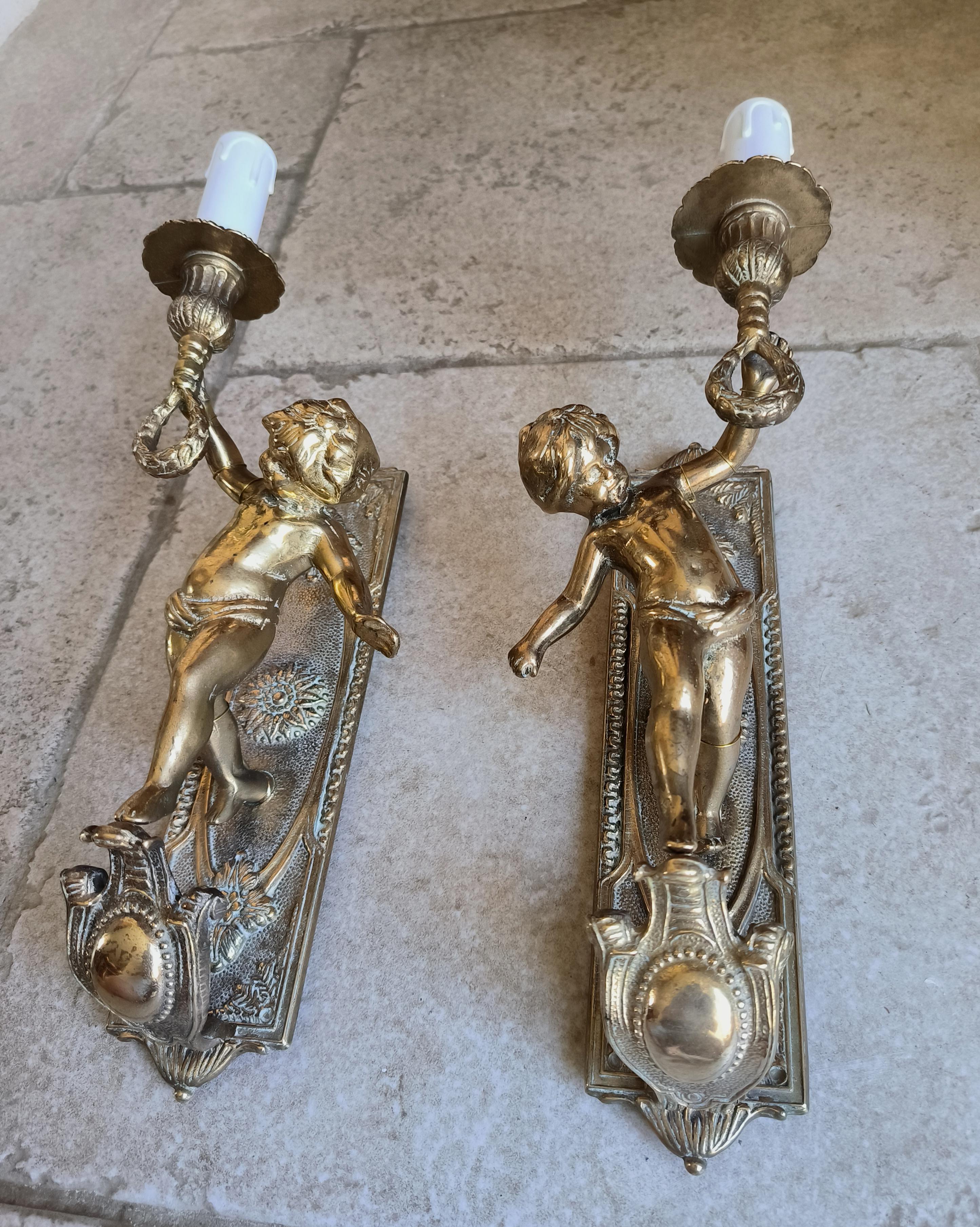 Cast Pair of Italian, Neoclassical style, solid bronze Cherub sconces. Circa 1950s