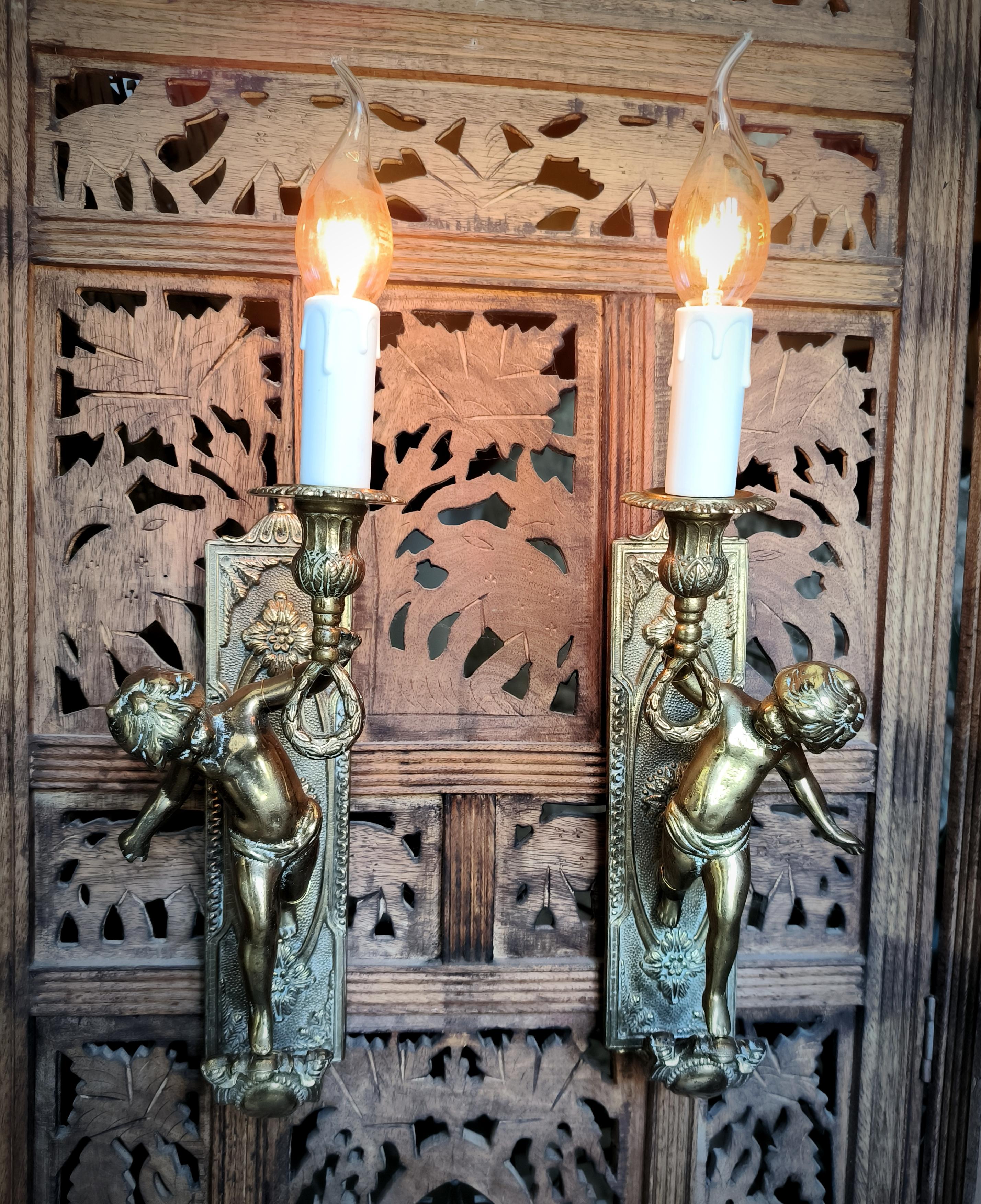 20th Century Pair of Italian, Neoclassical style, solid bronze Cherub sconces. Circa 1950s