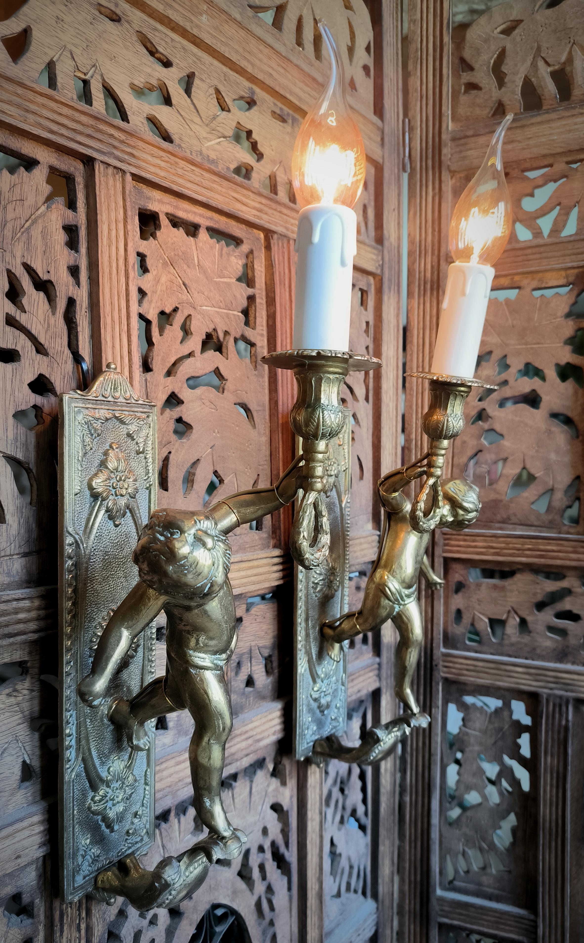 Bronze Pair of Italian, Neoclassical style, solid bronze Cherub sconces. Circa 1950s