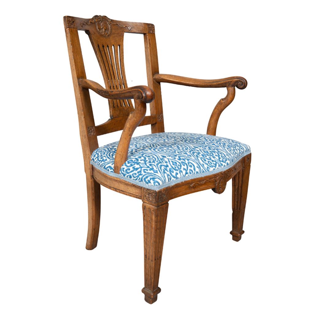 With slightly arched back with central portrait medallion over a pierced splat, upholstered seat , carved arms, seat rail with carved portrait medallion, raised on square tapered fluted legs.