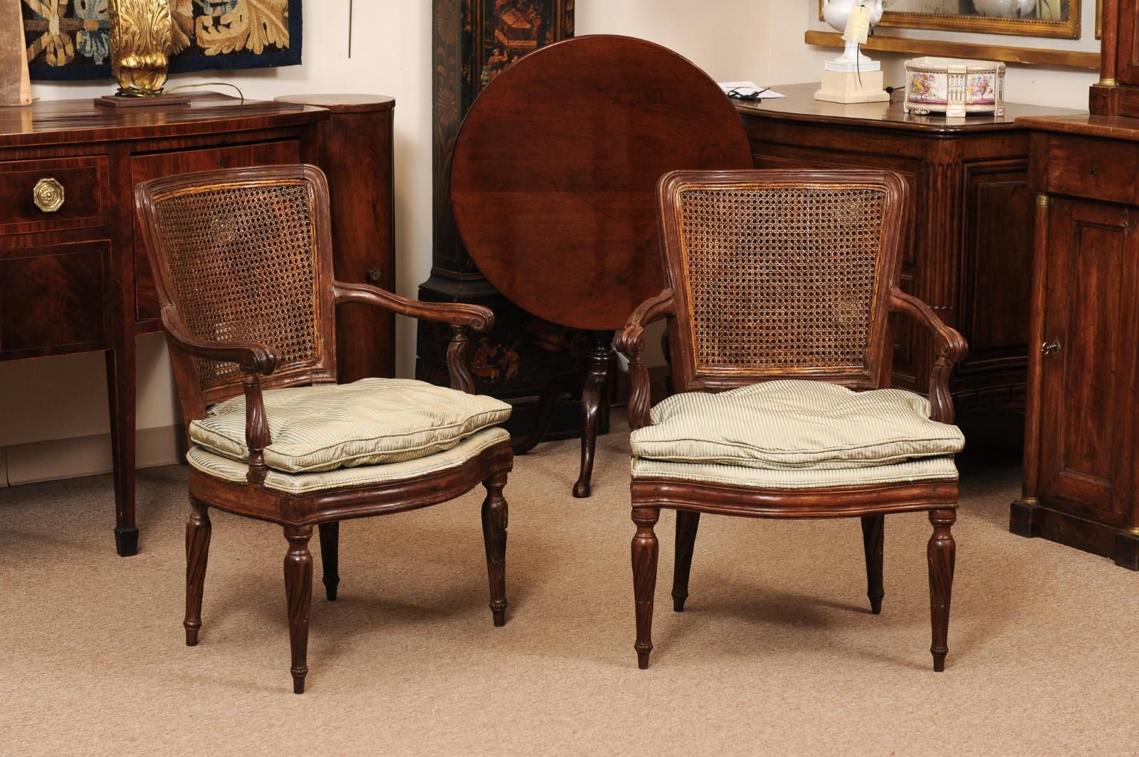 Pair of Italian Neoclassical Walnut Fauteuils with Cane Backs and Twisted Fluted Legs, ca. 1790