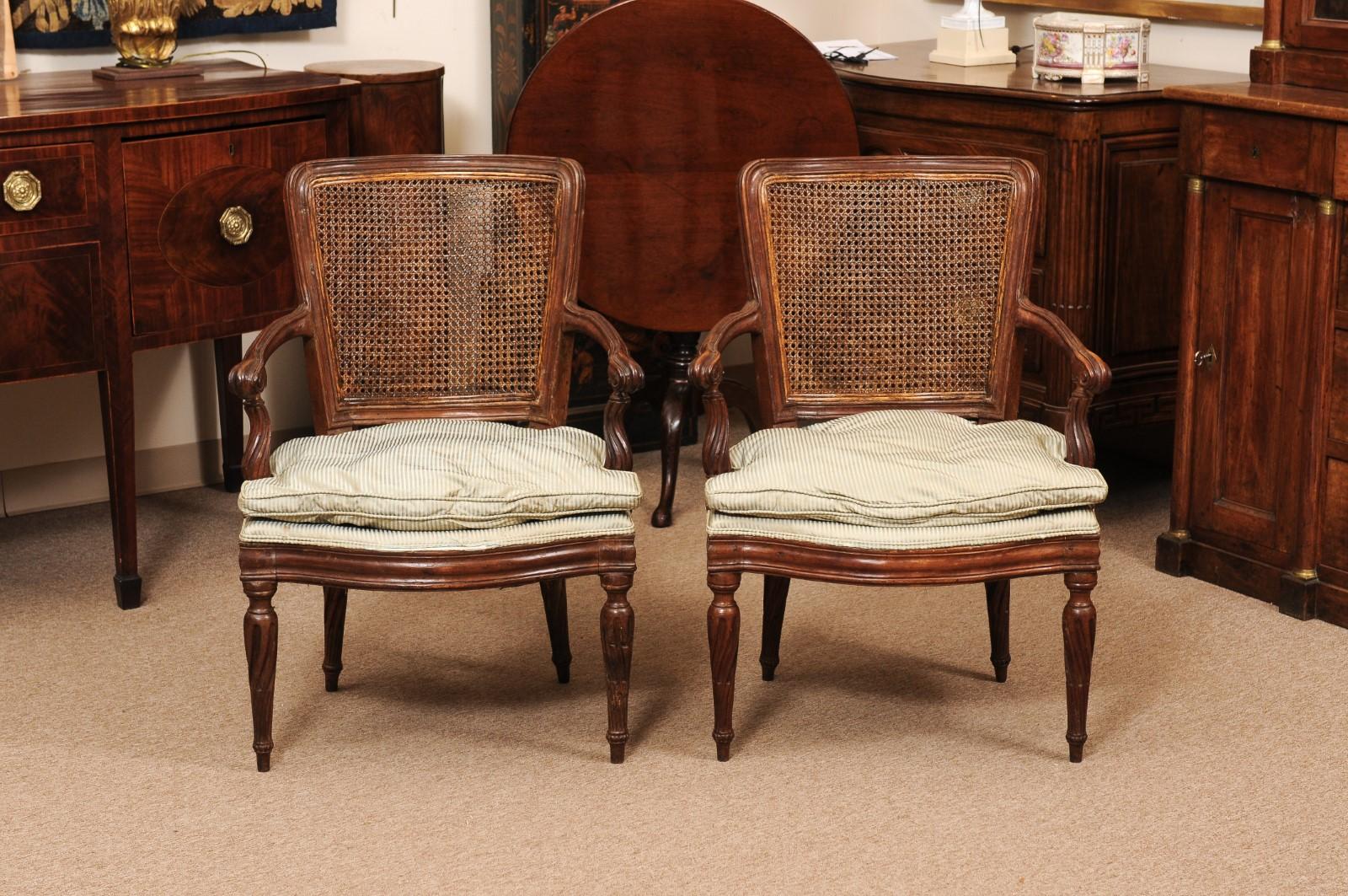 Pair of Italian Neoclassical Walnut Fauteuils with Cane Backs For Sale 1