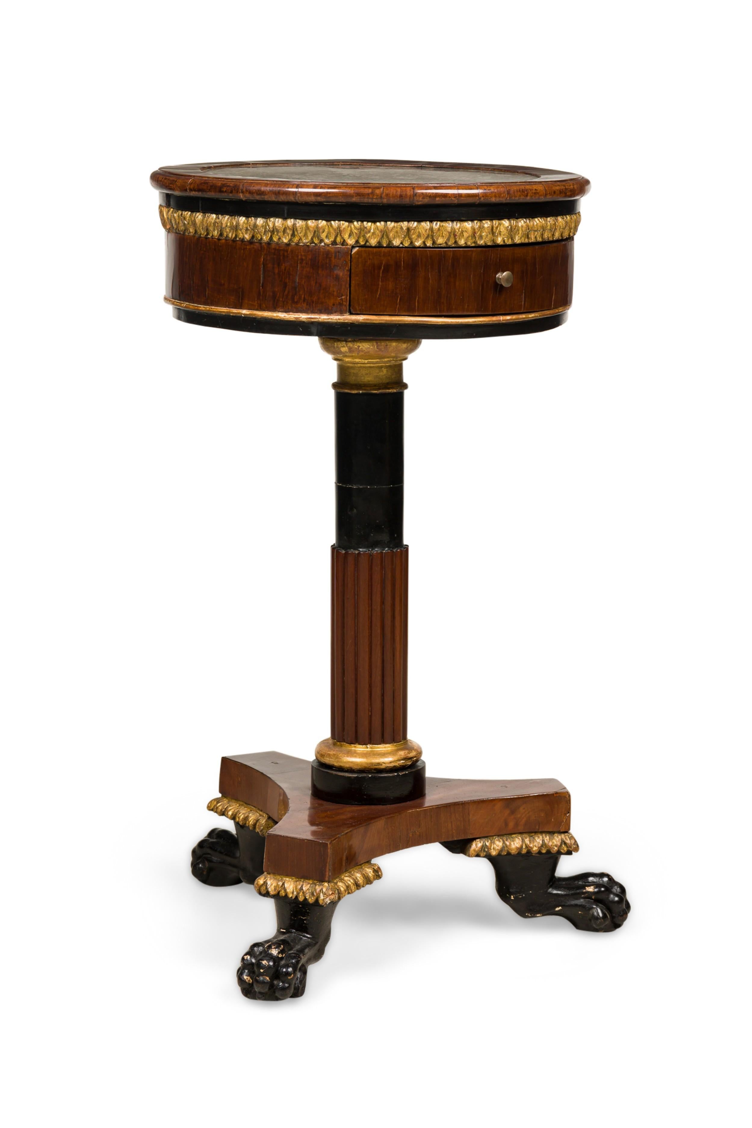 PAIR of Italian Neo-classic (18/19th Century) mahagany and gilt trim gueridon end tables having a round inset marble top over a small draw resting on a narrow pedestal ending on a base with three ebonized claw feet (PRICED AS PAIR)
