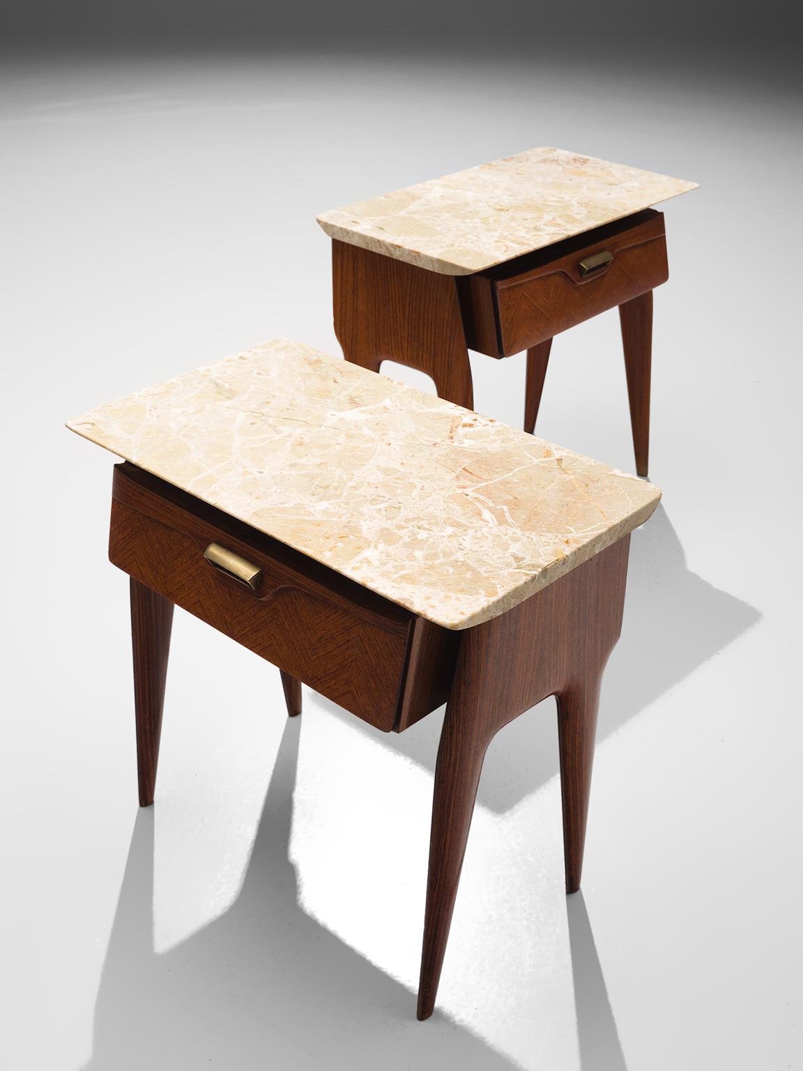 Side tables, wood, marble, brass, Italy, circa 1950.

These two side tables or nightstands are both refined and elegant in every way. The marble top stretches a little but over the outer edges of the tapered legs. These sculptural Italian tables