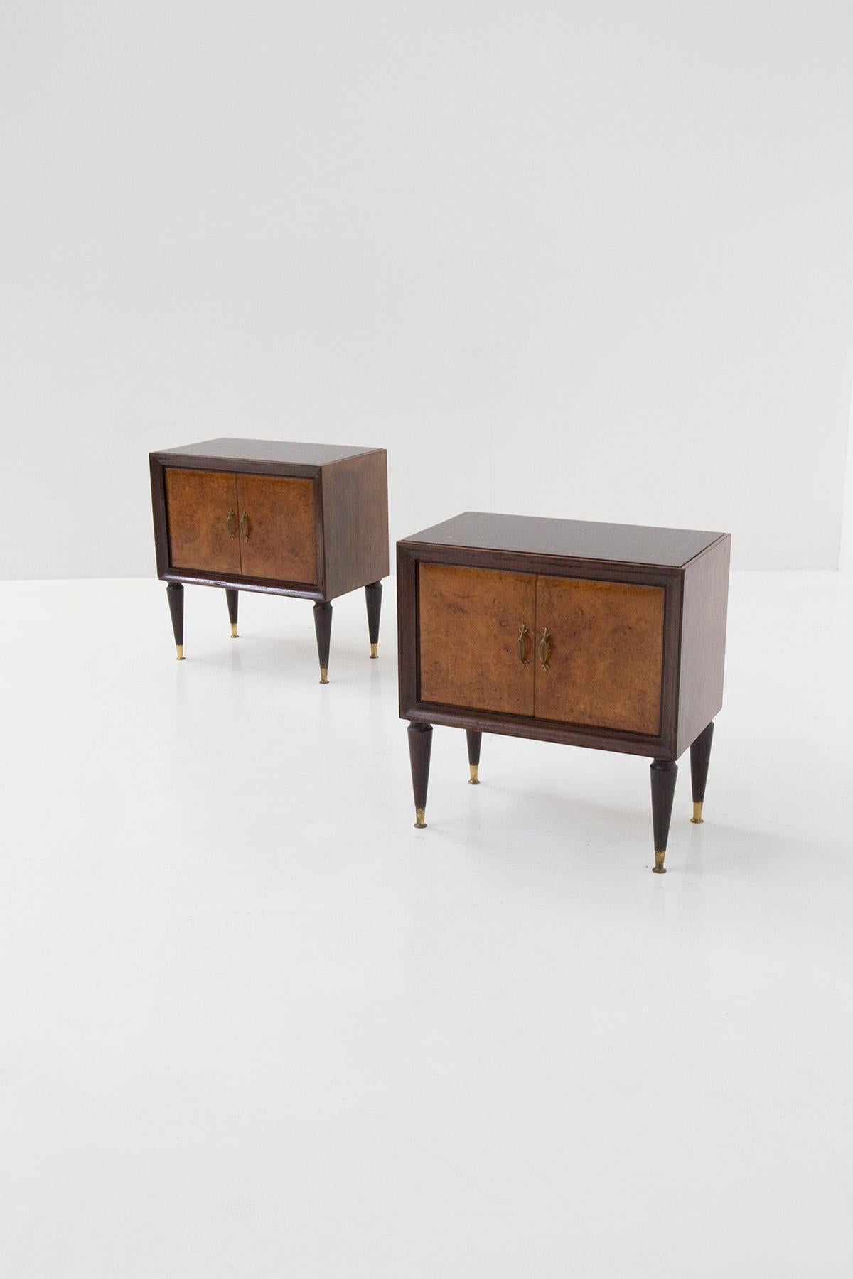 Elegant pair of 1950s Italian bedside tables attributed to Paolo Buffa. The bedside tables present a typical Italian mid-century line. They are made of different woods, in fact for its frame we notice a walnut wood while its where doors are made of