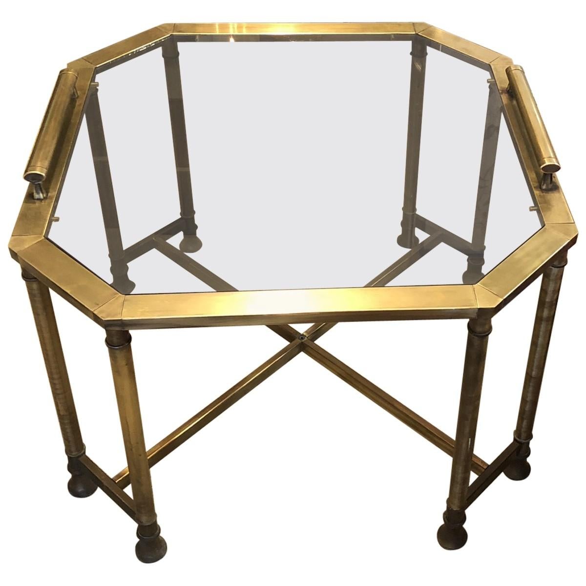 Sleek and shapely, this eye-catching pair of octagon-shaped metal coffee tables features smoked glass tops and brass finishes. Raised handles ensure these sophisticated coffee tables are every bit as functional as they are stylish.
Sold as a set of