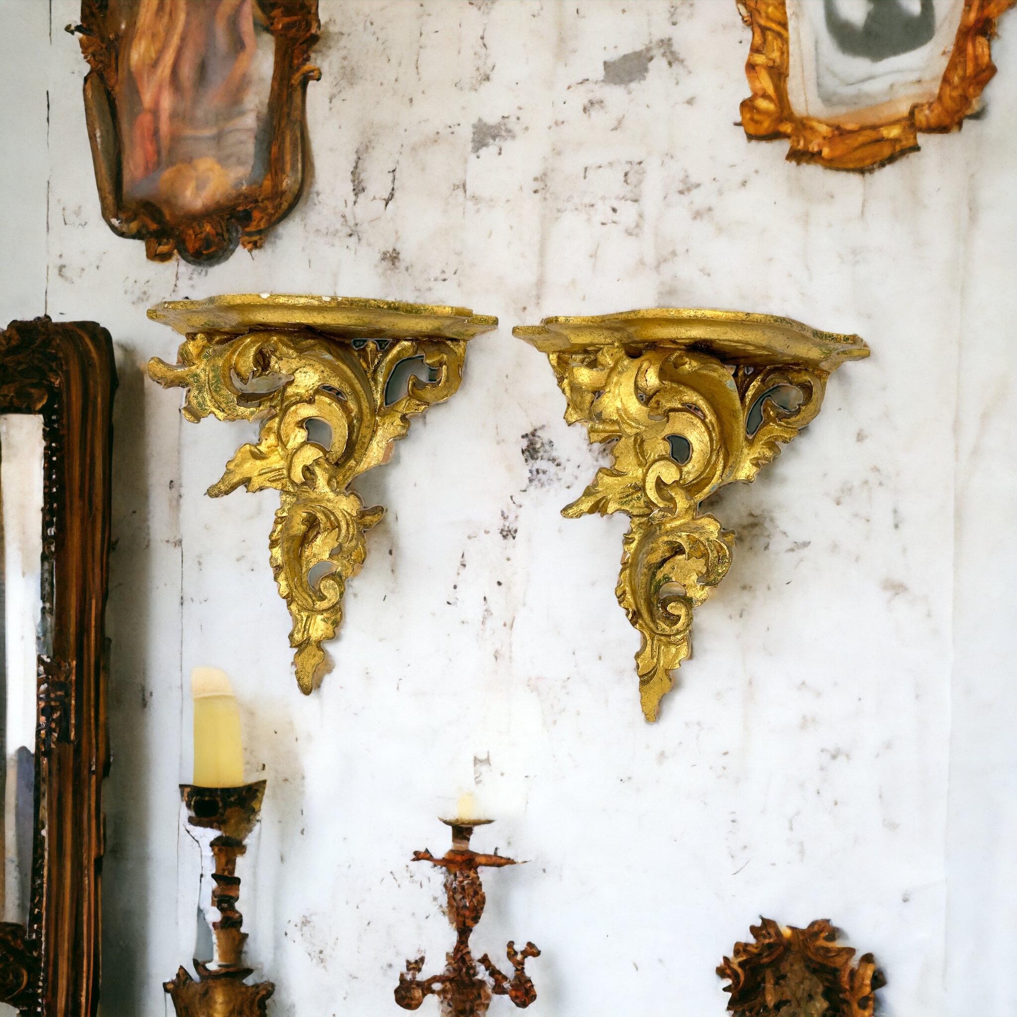 Offered is an absolutely stunning pair of, 1950s Italian gilt wood wall shelves or wall consoles. Minor patina gives this piece a classy statement. Made of hand carved wood and gold plated. A nice shelf to present a statuette or a beautiful object.