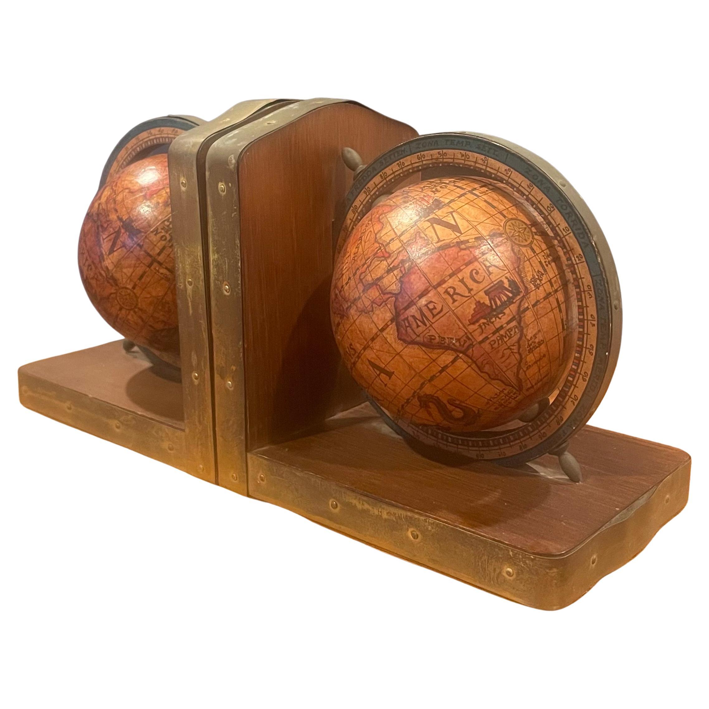 Classic pair of Italian old world style globe bookends on wood 